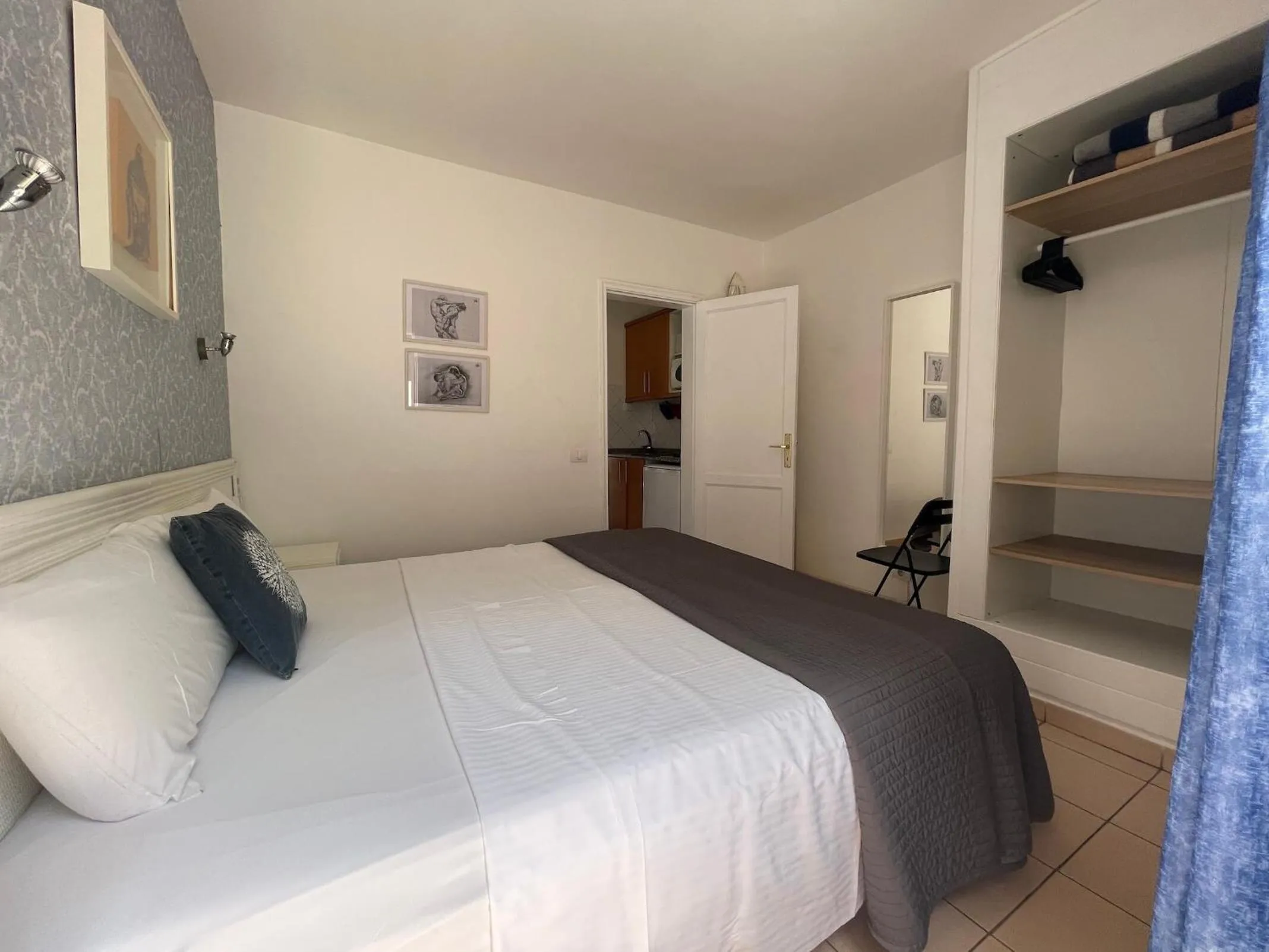 Bed in Rainbow Golf Bungalows, Gay Men-only Resort