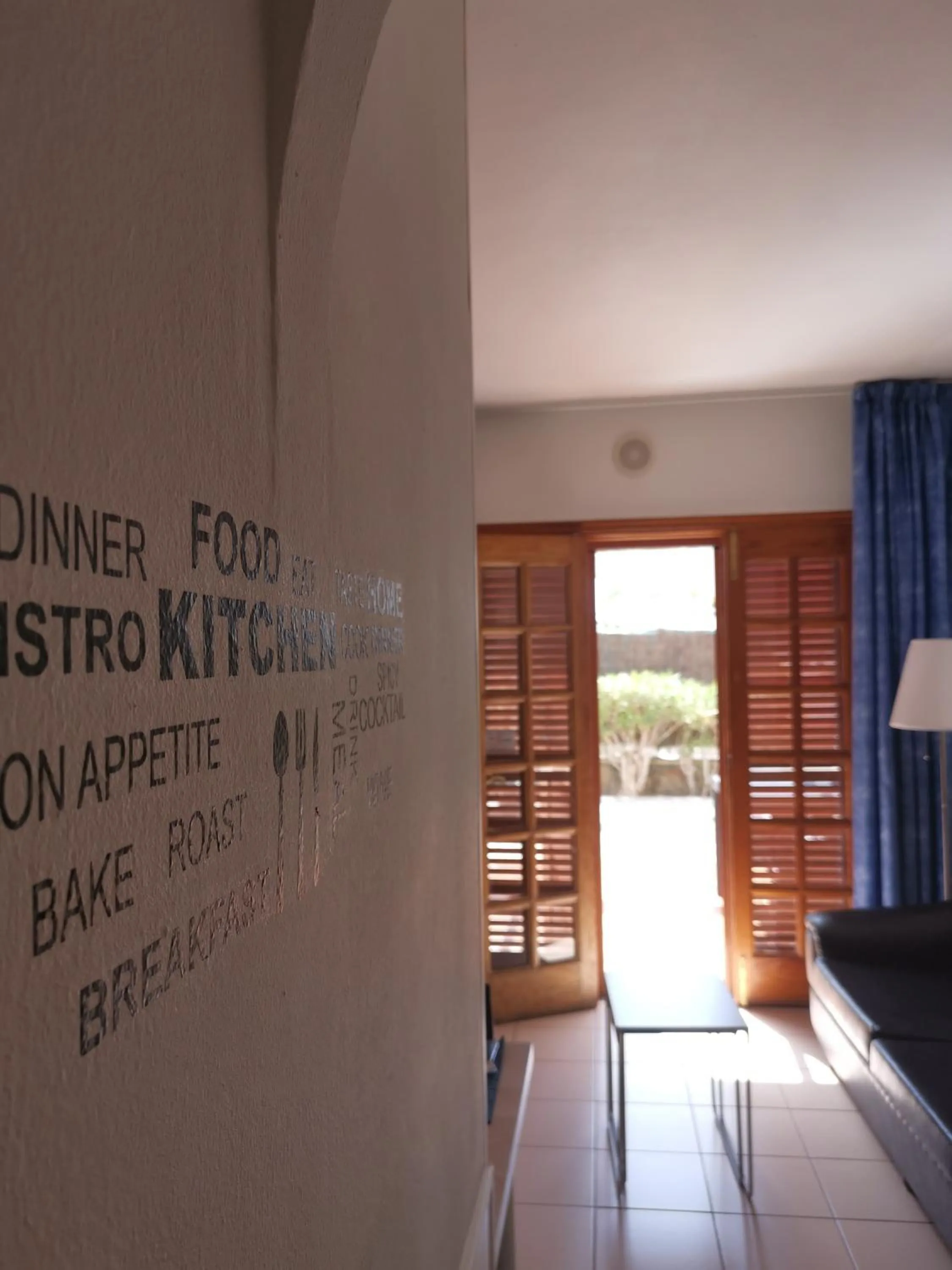 Living room in Rainbow Golf Bungalows, Gay Men-only Resort