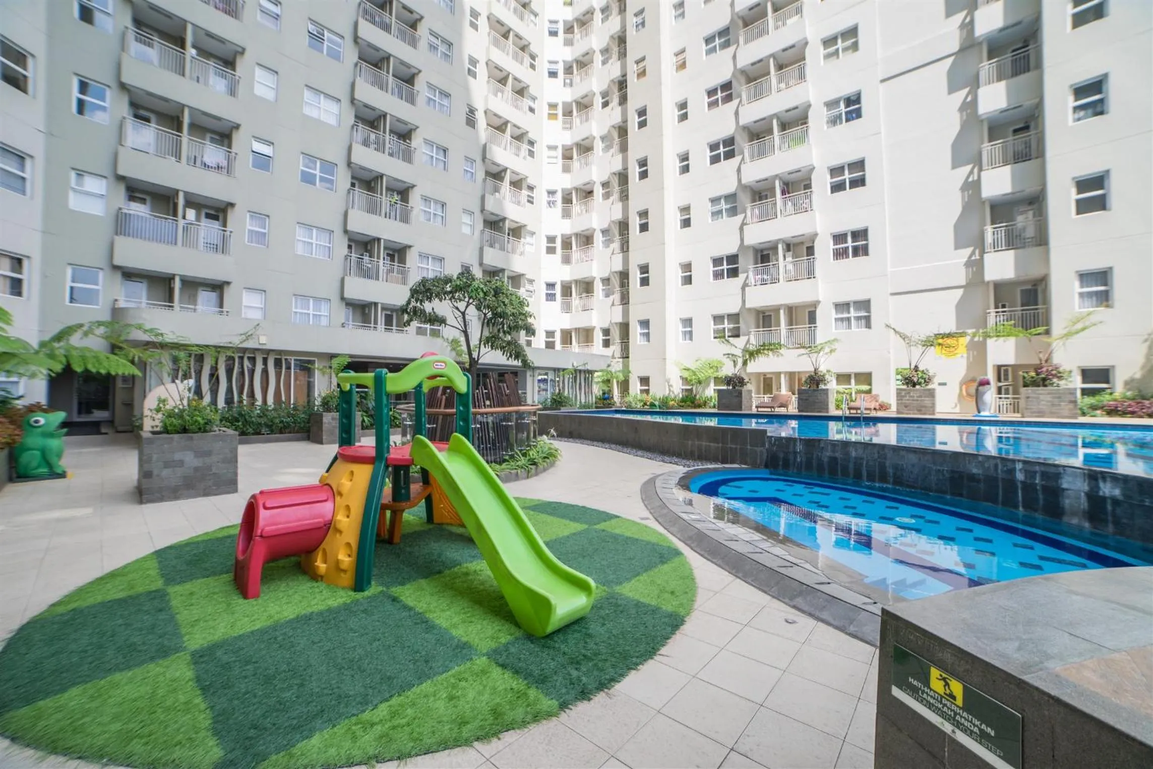 Property building in Minimalist 2BR Apartment at Parahyangan Residence By Travelio