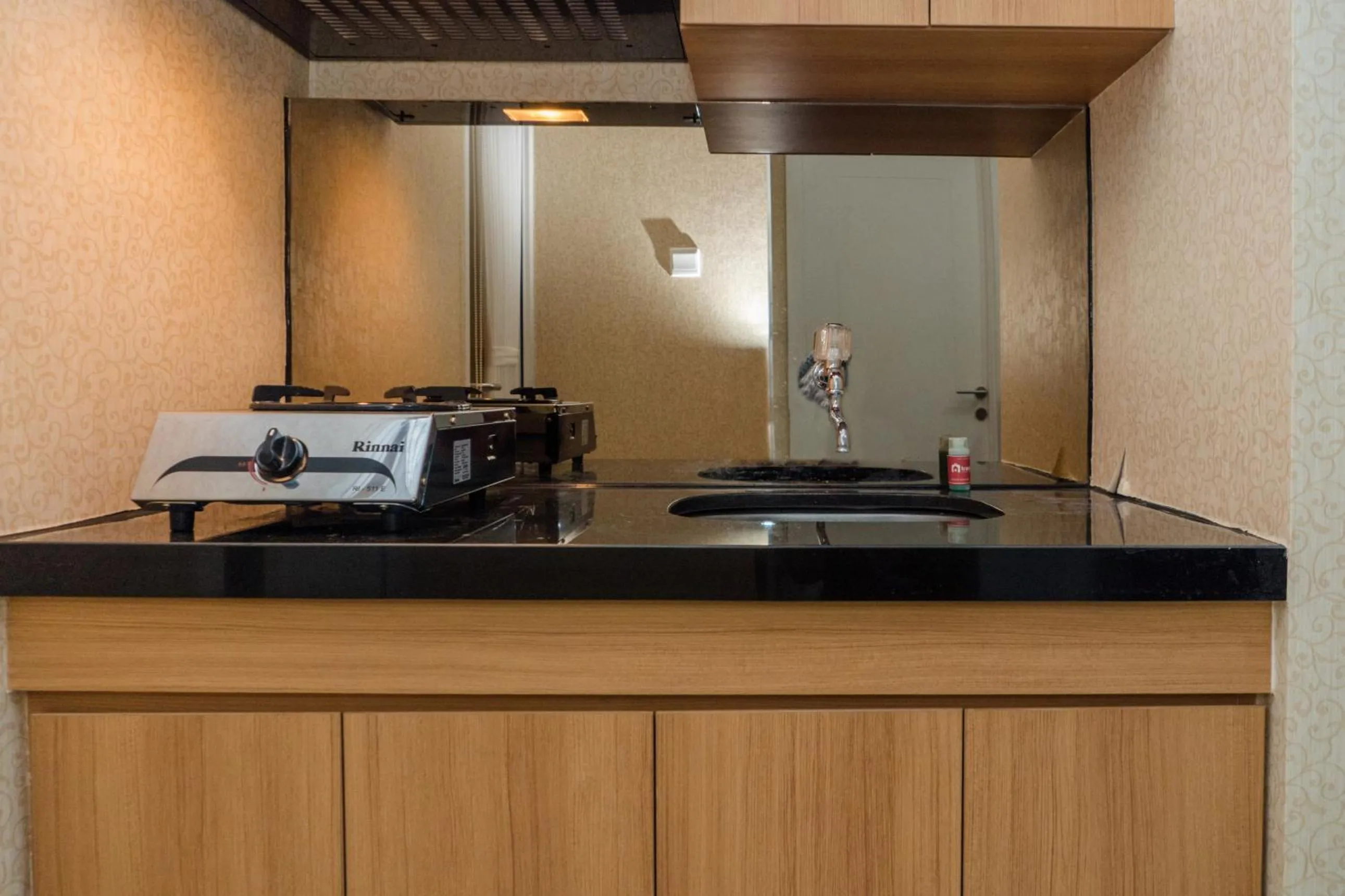 Minimalist 2BR Apartment at Parahyangan Residence By Travelio