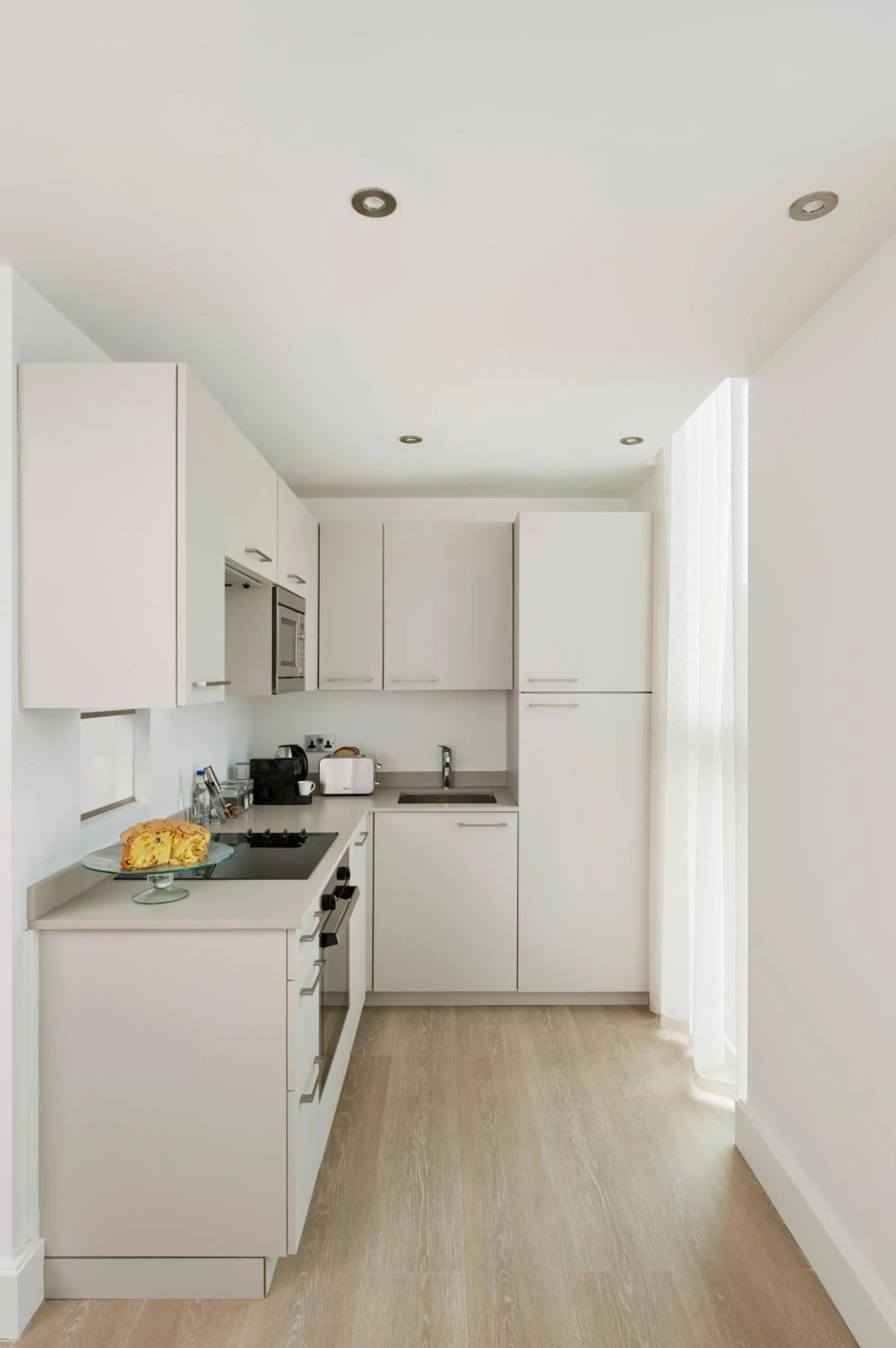 Kitchen or kitchenette in The Chronicle by Supercity Aparthotels