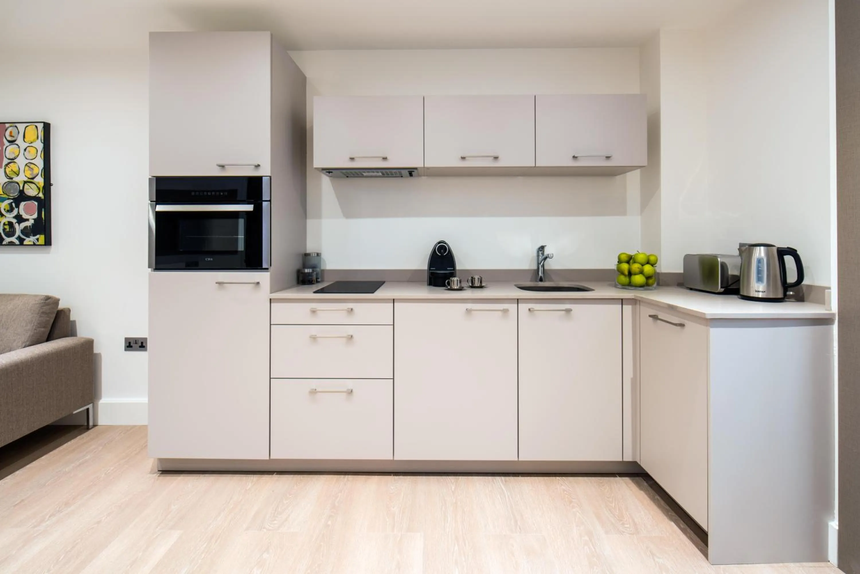Kitchen or kitchenette in The Chronicle by Supercity Aparthotels
