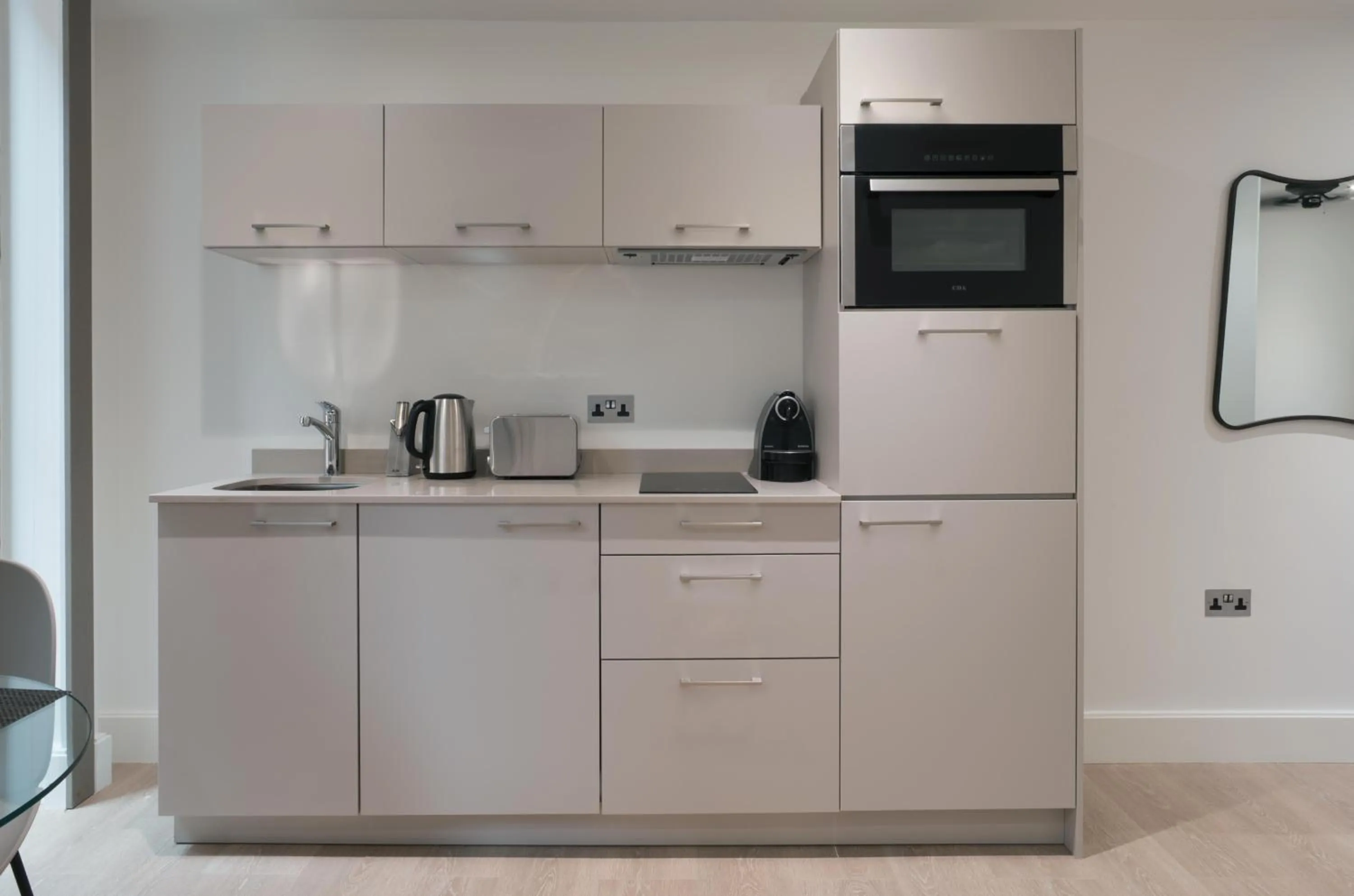 Kitchen or kitchenette in The Chronicle by Supercity Aparthotels