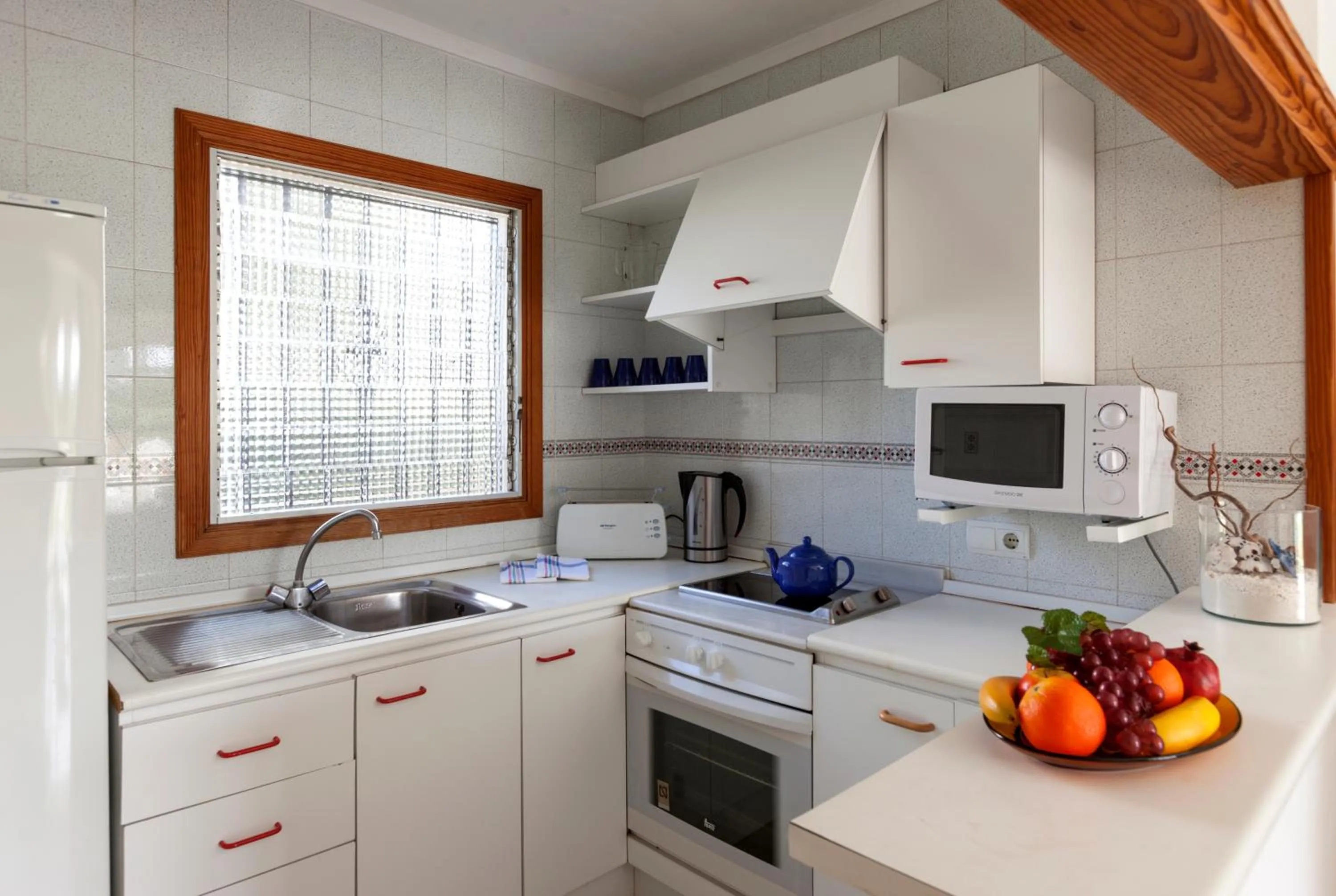 Kitchen or kitchenette in Apartamentos Leo