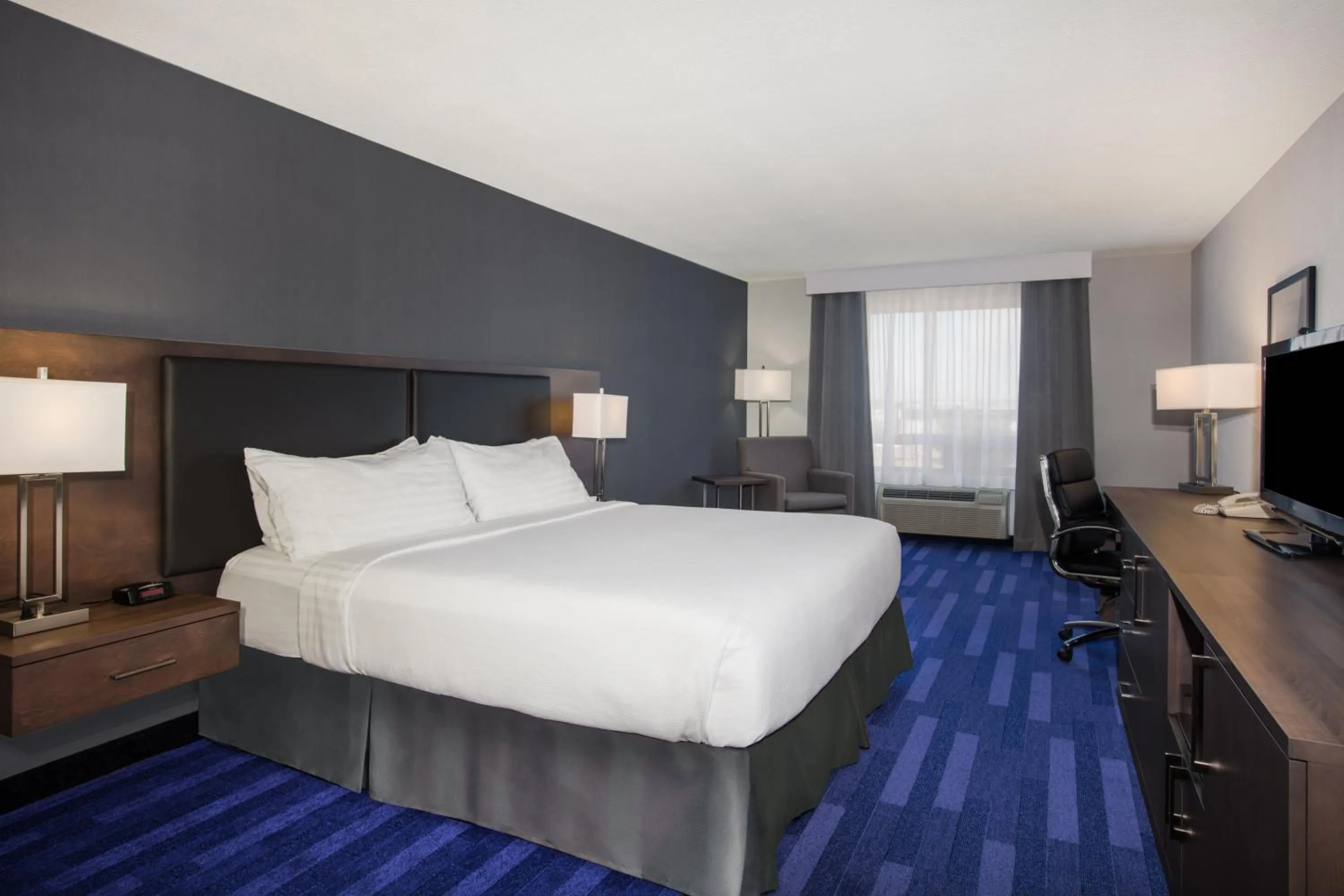 Photo of the whole room, Bed in Holiday Inn & Suites Grande Prairie by IHG