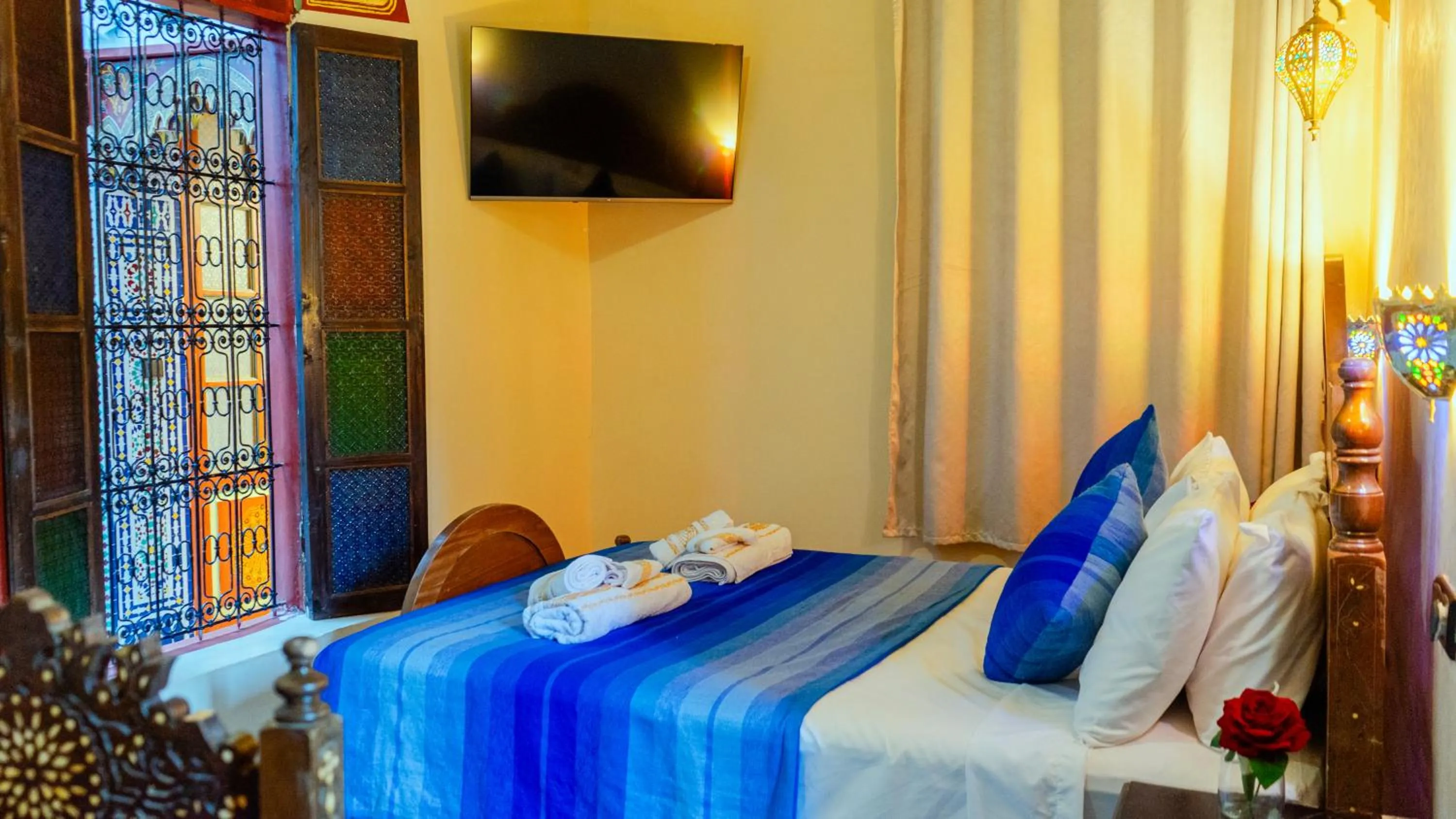 Communal lounge/ TV room, Bed in Riad Dar El Ouedghiri