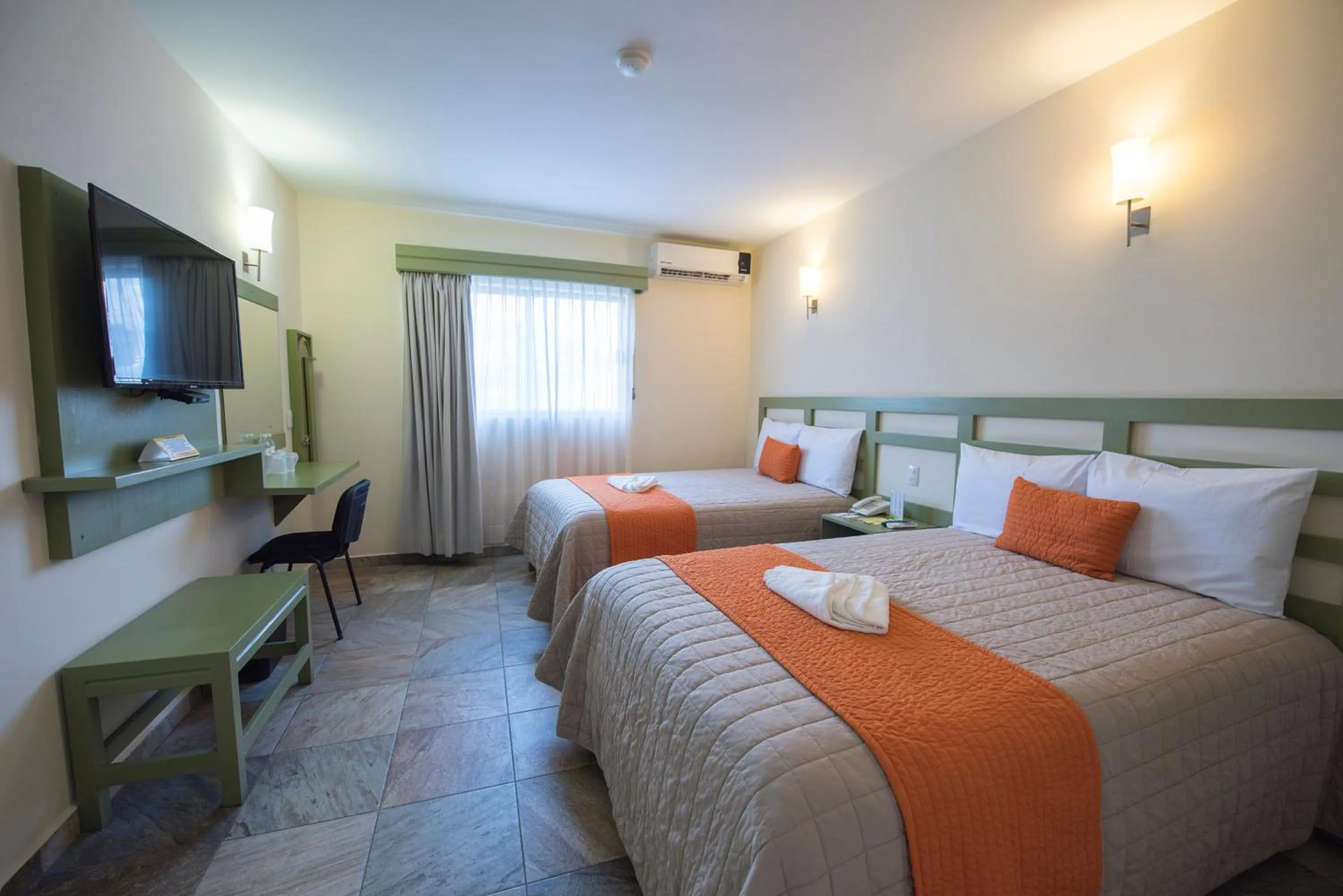 Bed in Hotel Palace Inn