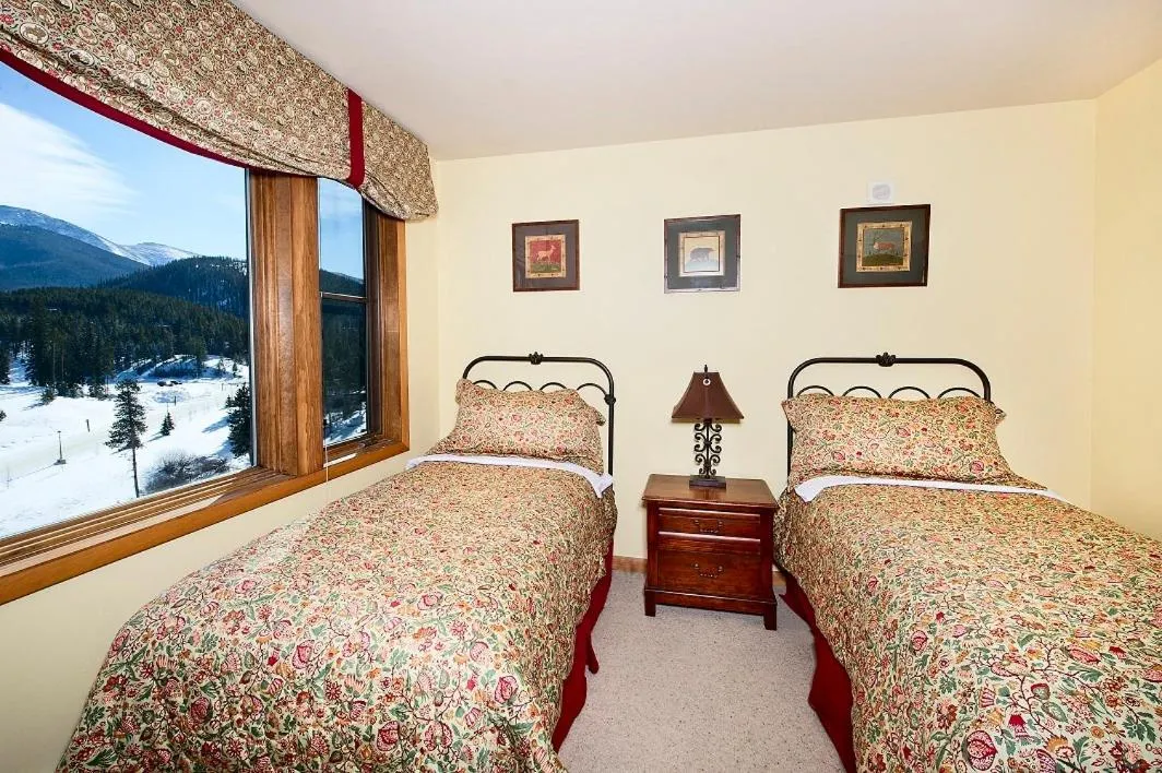 Bed in Zephyr Mountain Lodge