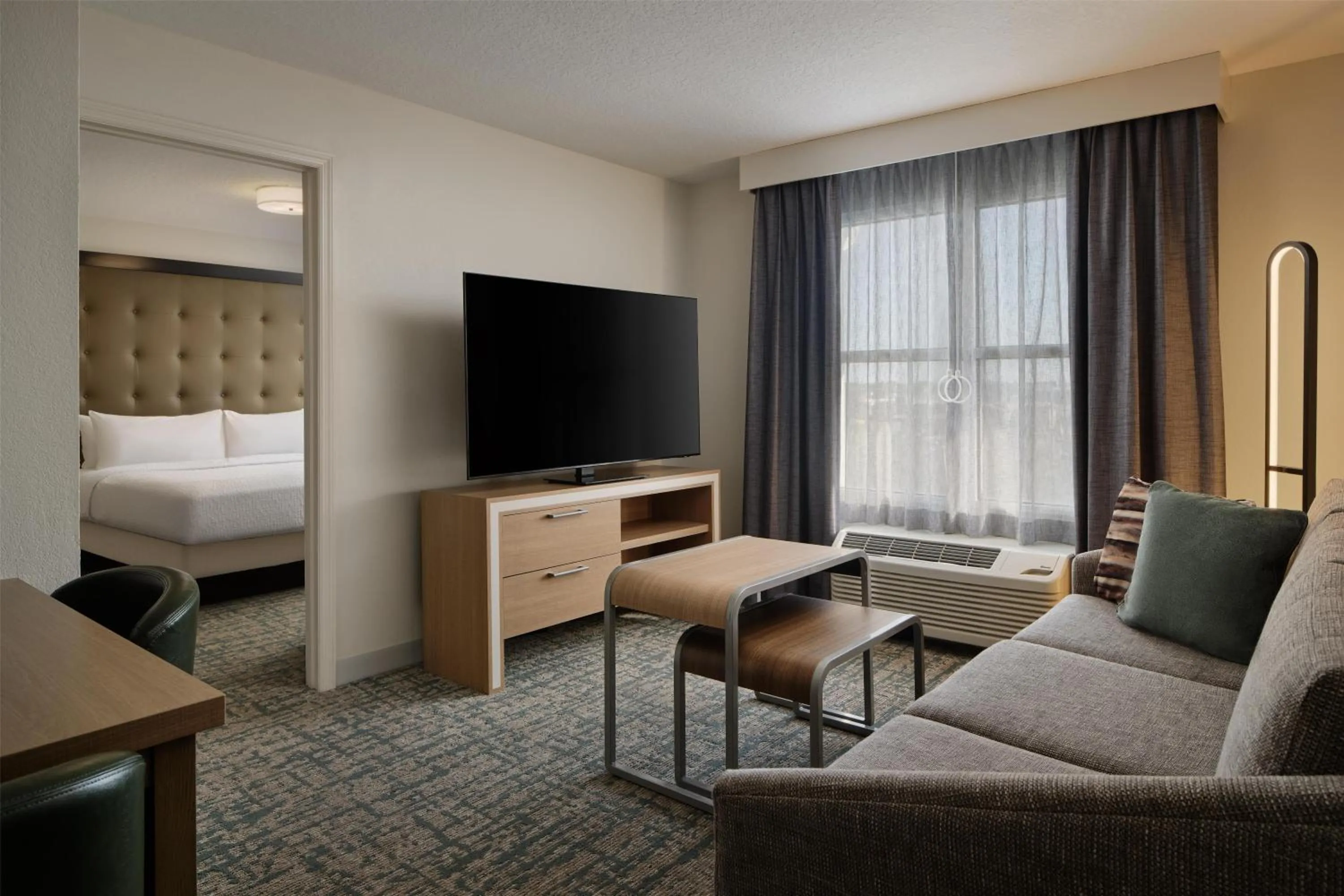 Living room, Bed in Homewood Suites by Hilton Daytona Beach Speedway-Airport