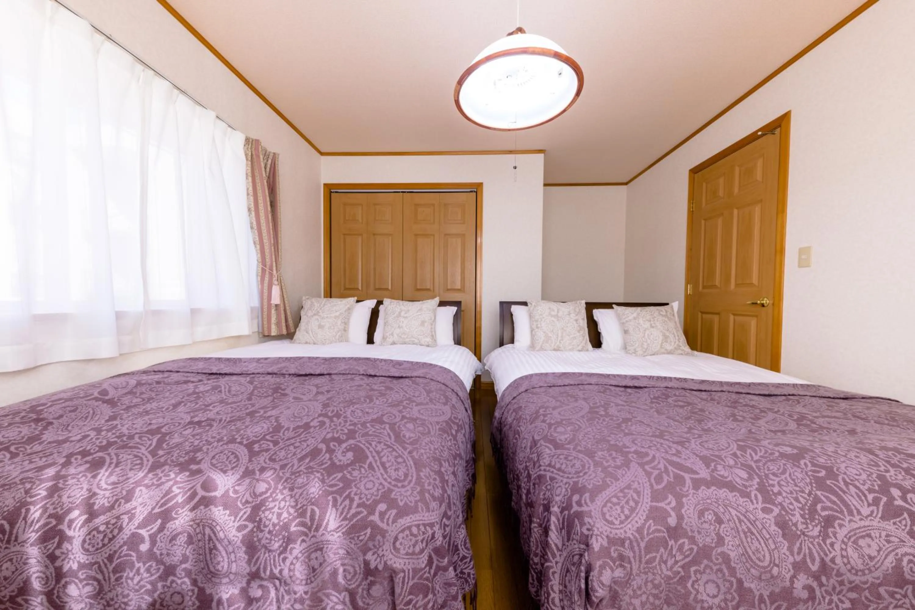 Bed in Ma Maison Mt. Fuji Kawaguchiko