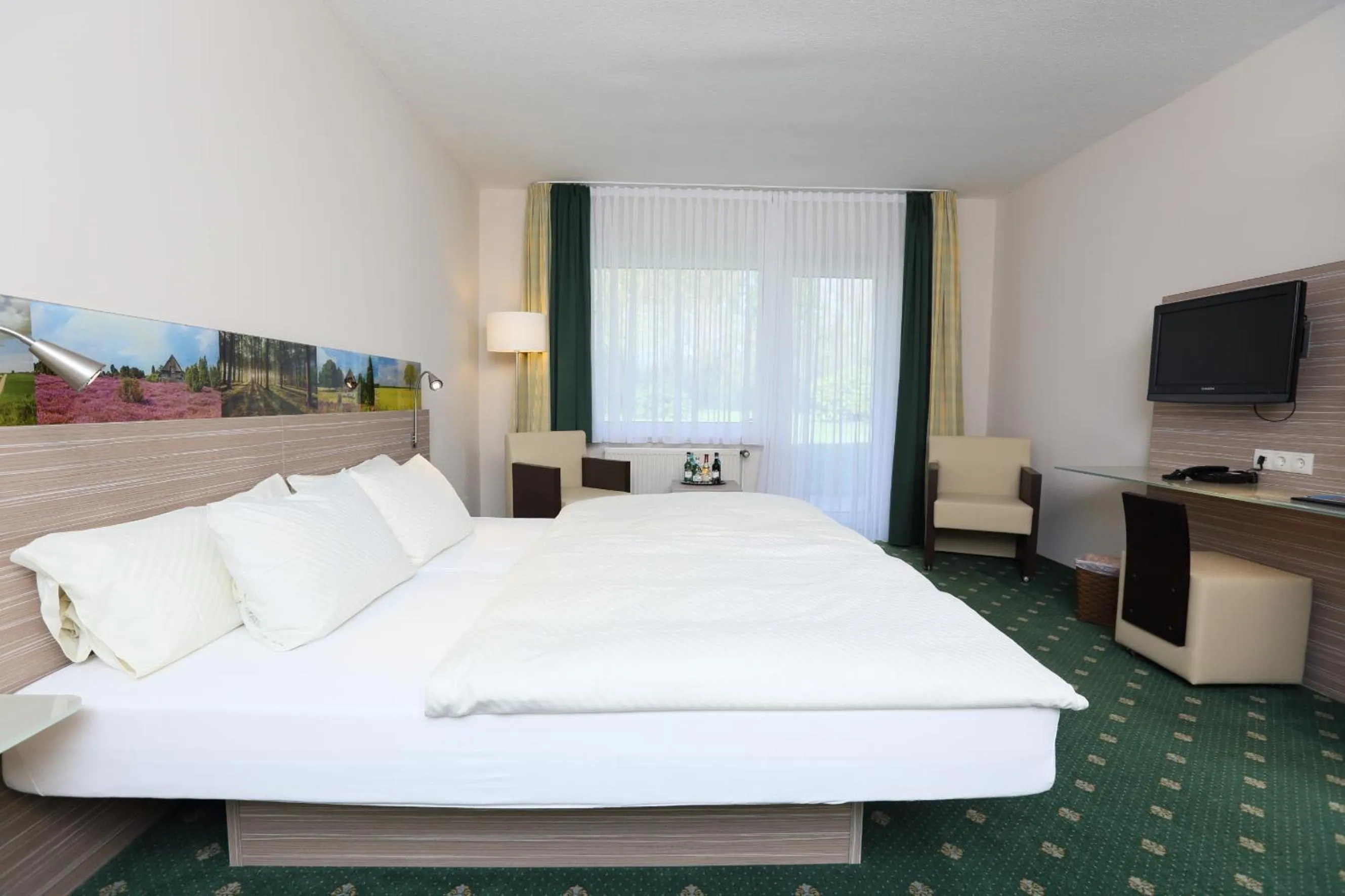 Photo of the whole room, Bed in Jeddinger Hof Land- und Seminarhotel