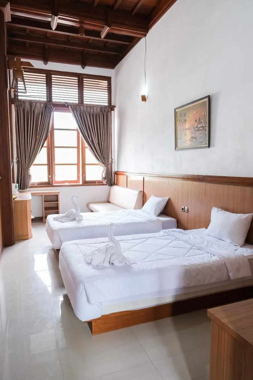Bed in Jawa Dwipa Heritage Resort
