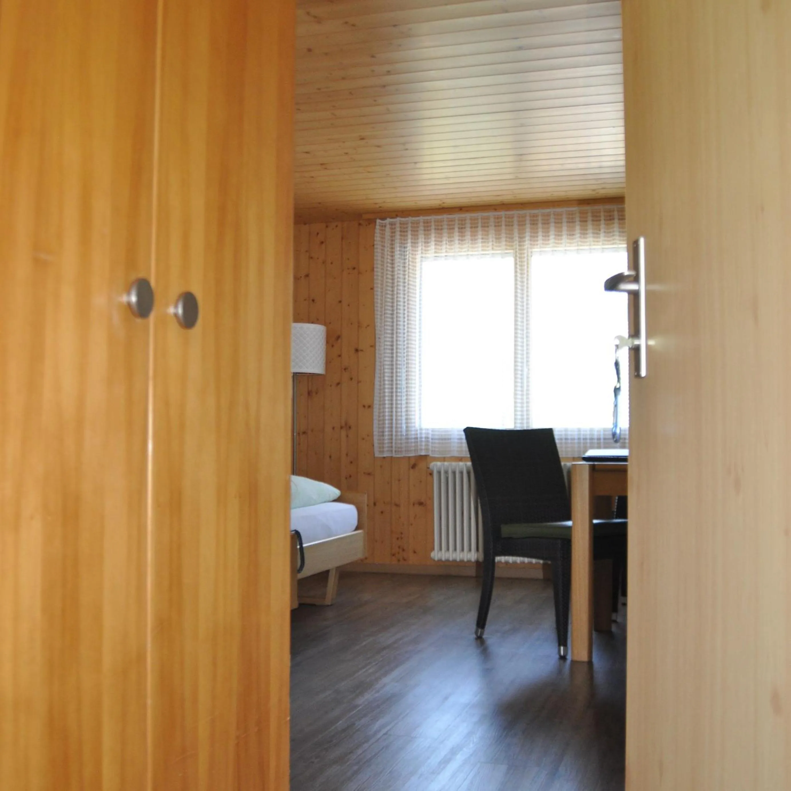 Photo of the whole room, Bed in Ferien- und Familienhotel Alpina Adelboden