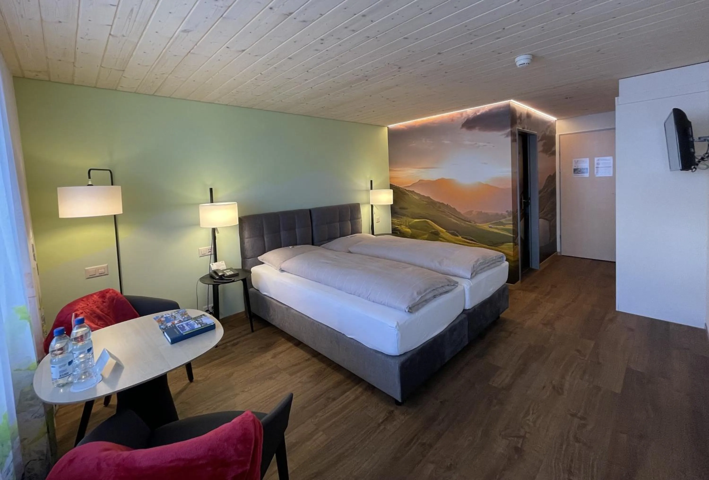 Photo of the whole room, Bed in Ferien- und Familienhotel Alpina Adelboden