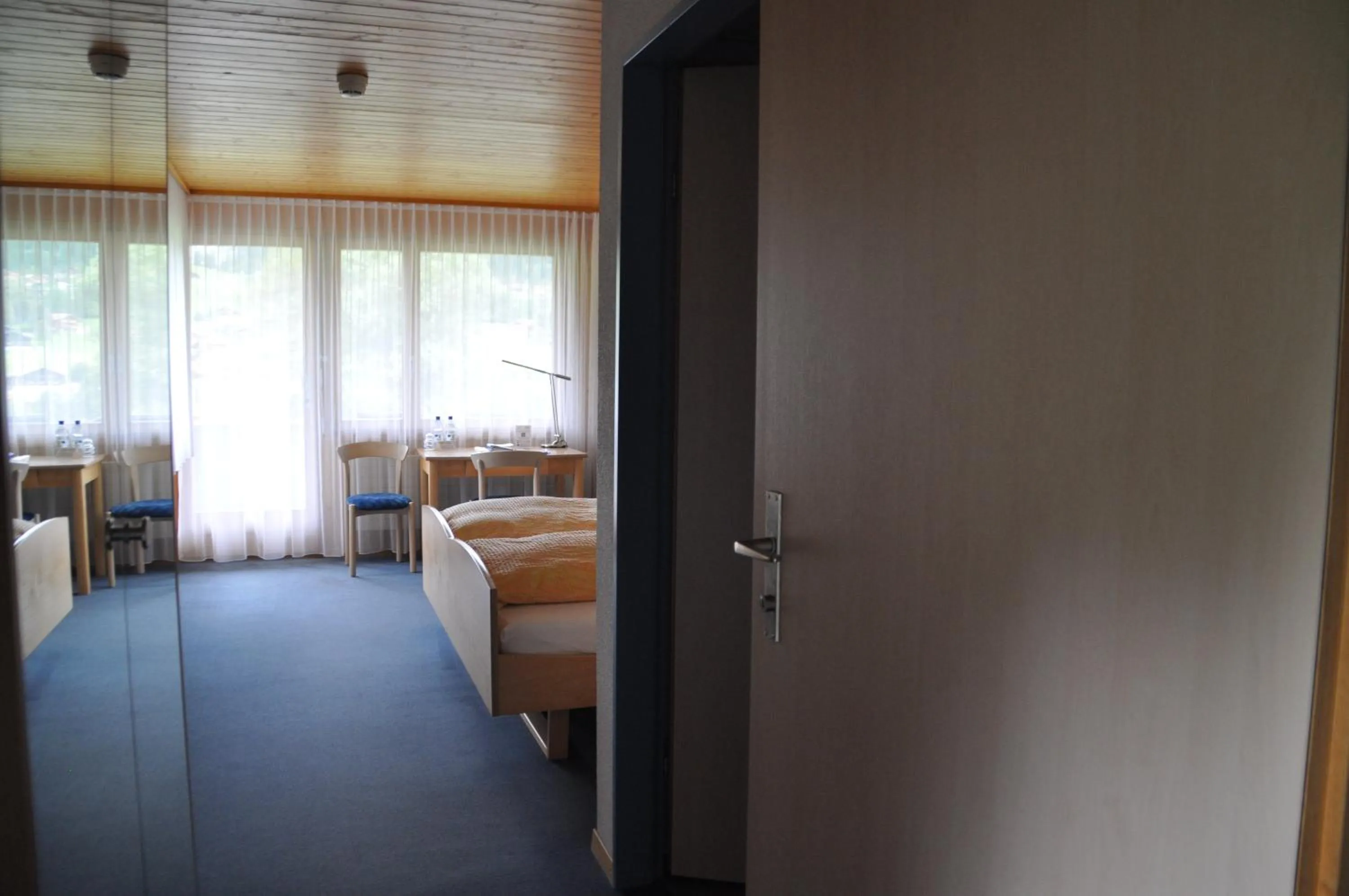 Photo of the whole room, Bed in Ferien- und Familienhotel Alpina Adelboden