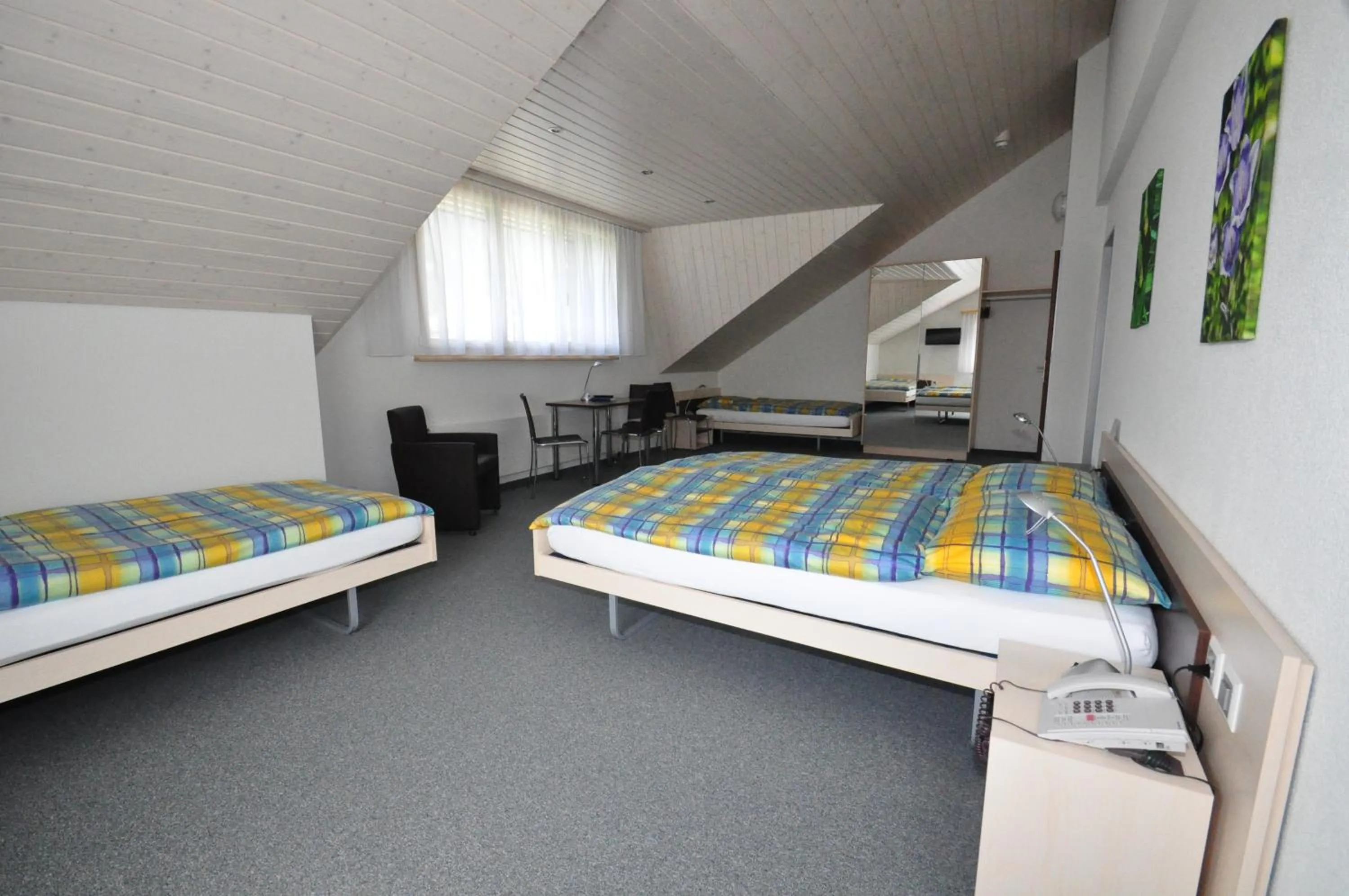 Photo of the whole room, Bed in Ferien- und Familienhotel Alpina Adelboden