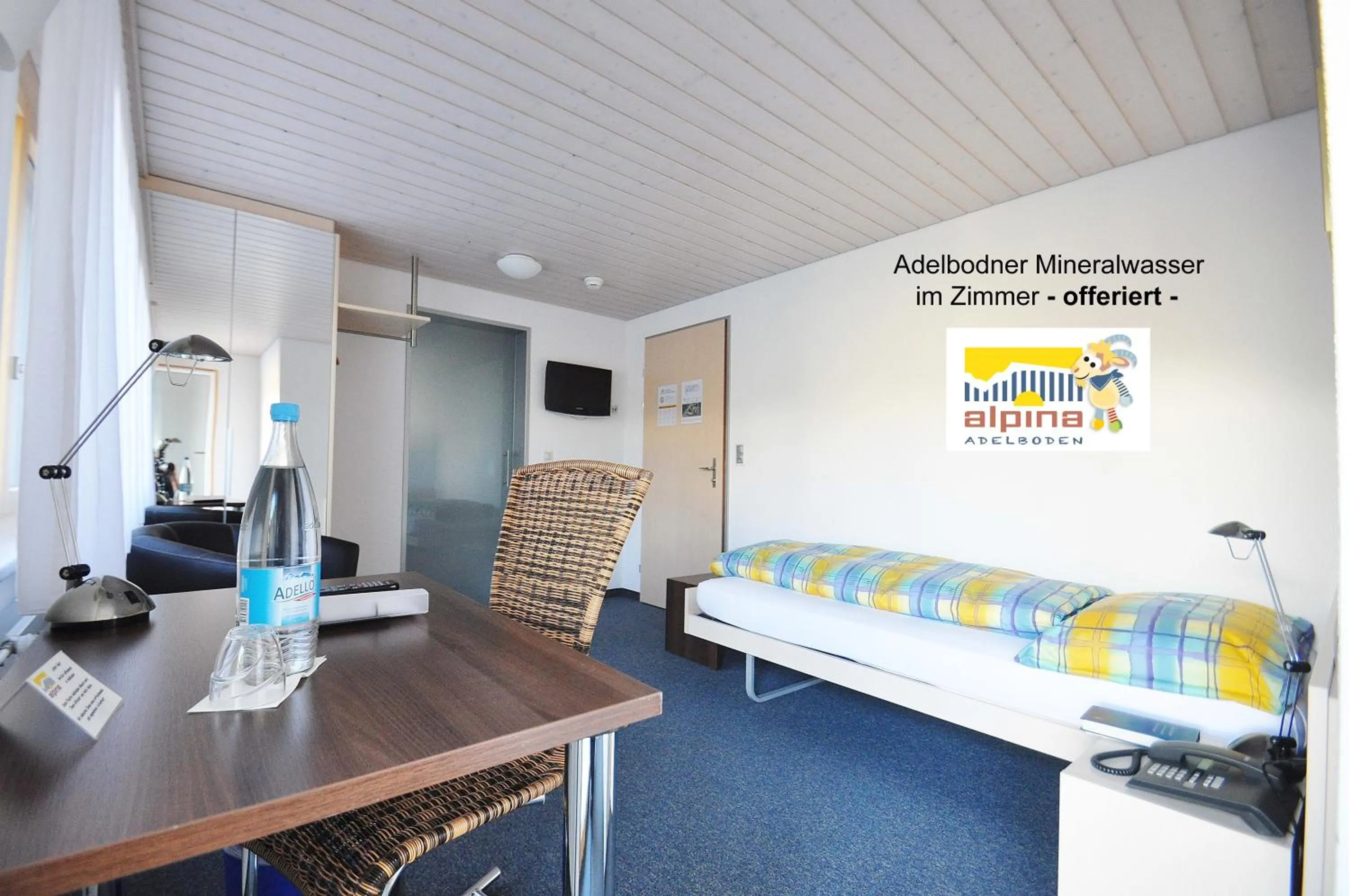 Photo of the whole room, Bed in Ferien- und Familienhotel Alpina Adelboden