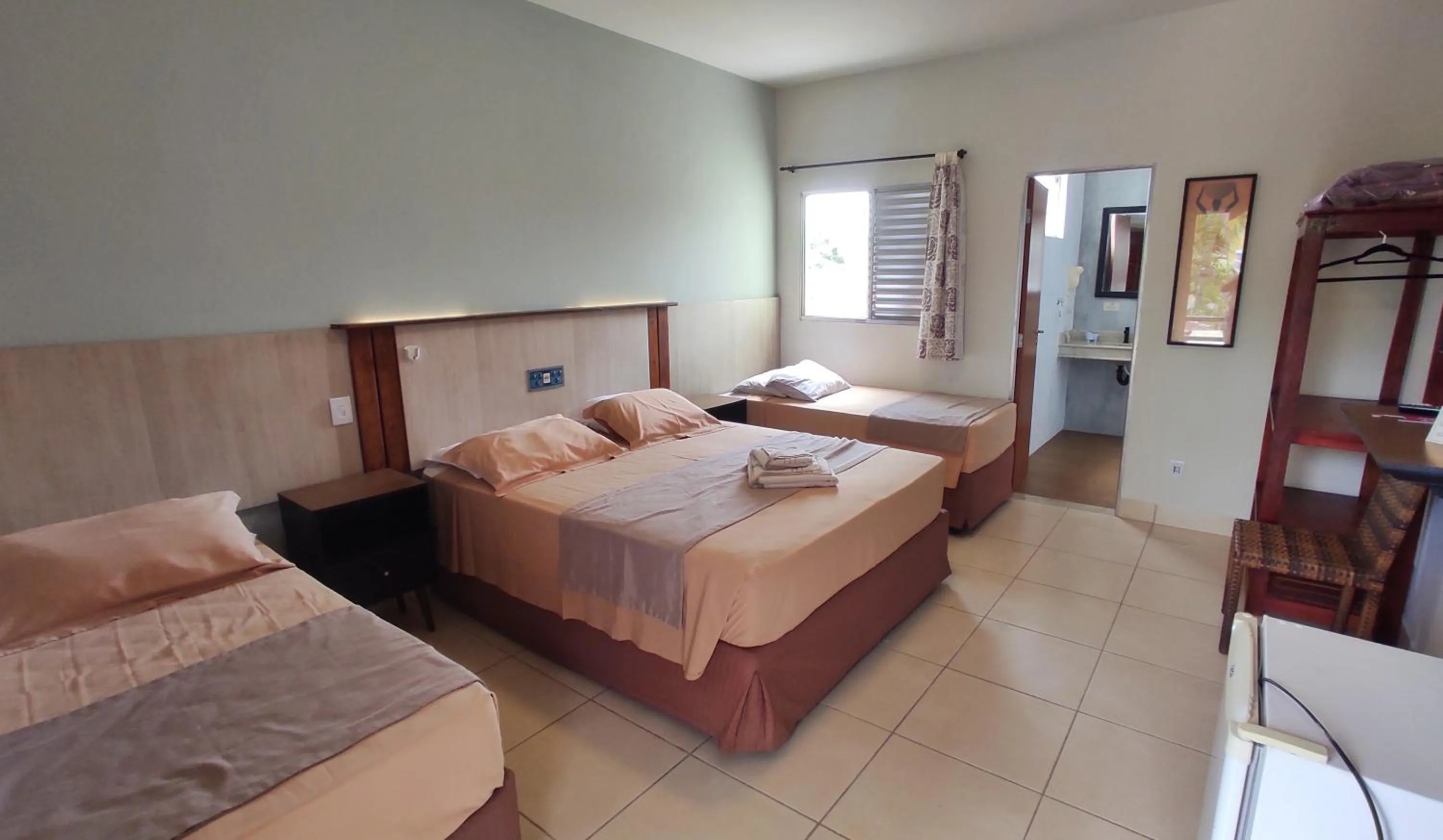 Bed in Pousada Novo Prado