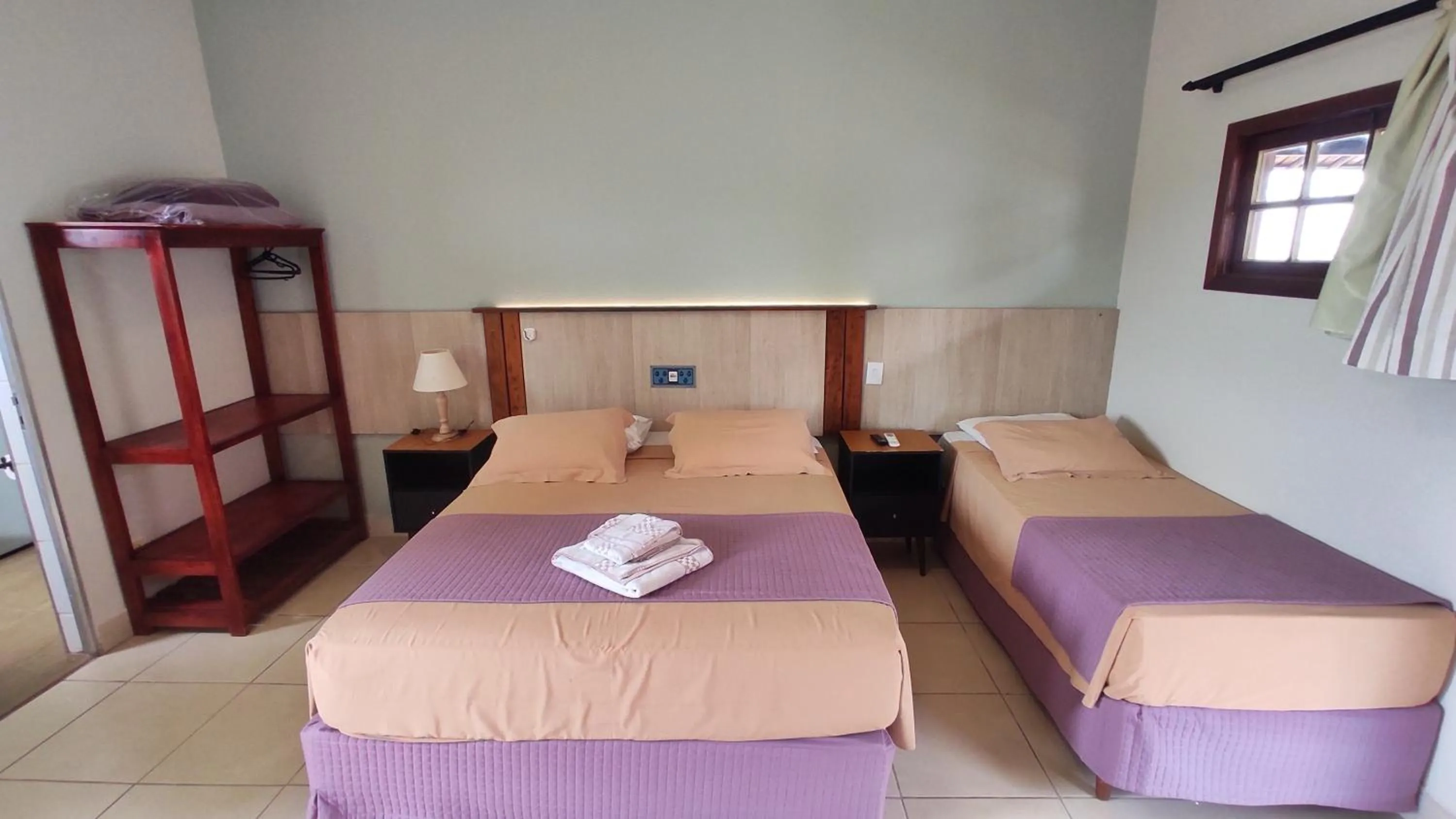 Bed in Pousada Novo Prado