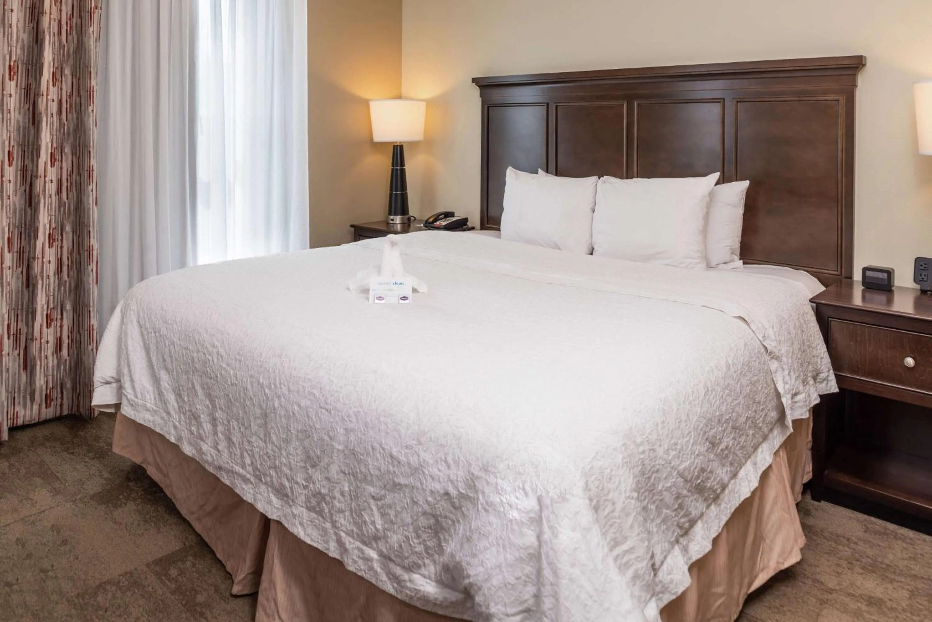 Bed in Hampton Inn & Suites Charlotte Arrowood Rd