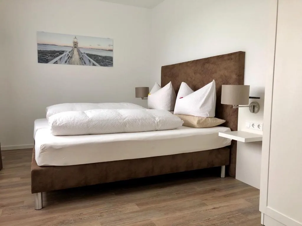 Bed in Appartements an der Golfanlage