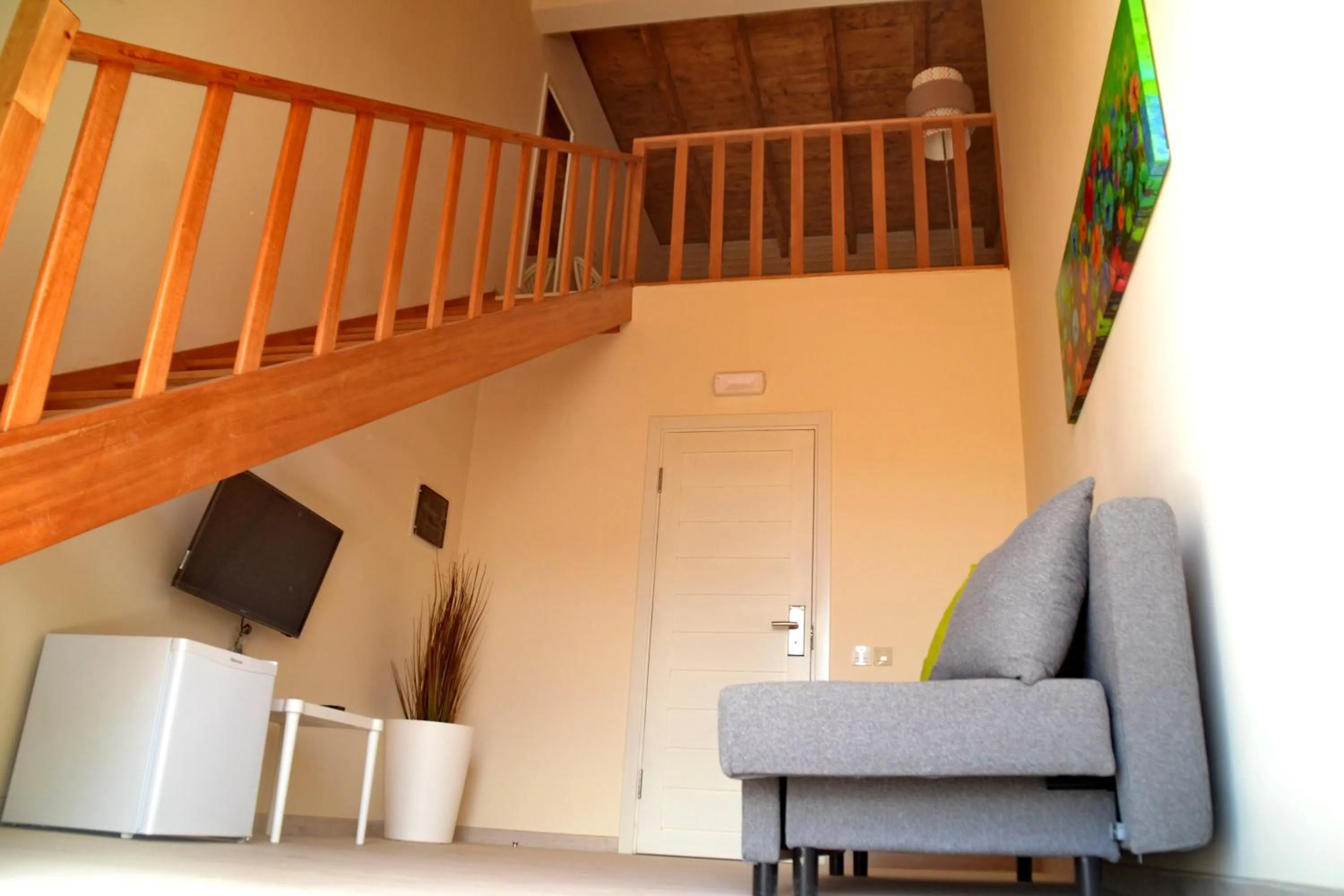 Communal lounge/ TV room in Ouril Hotel Julia