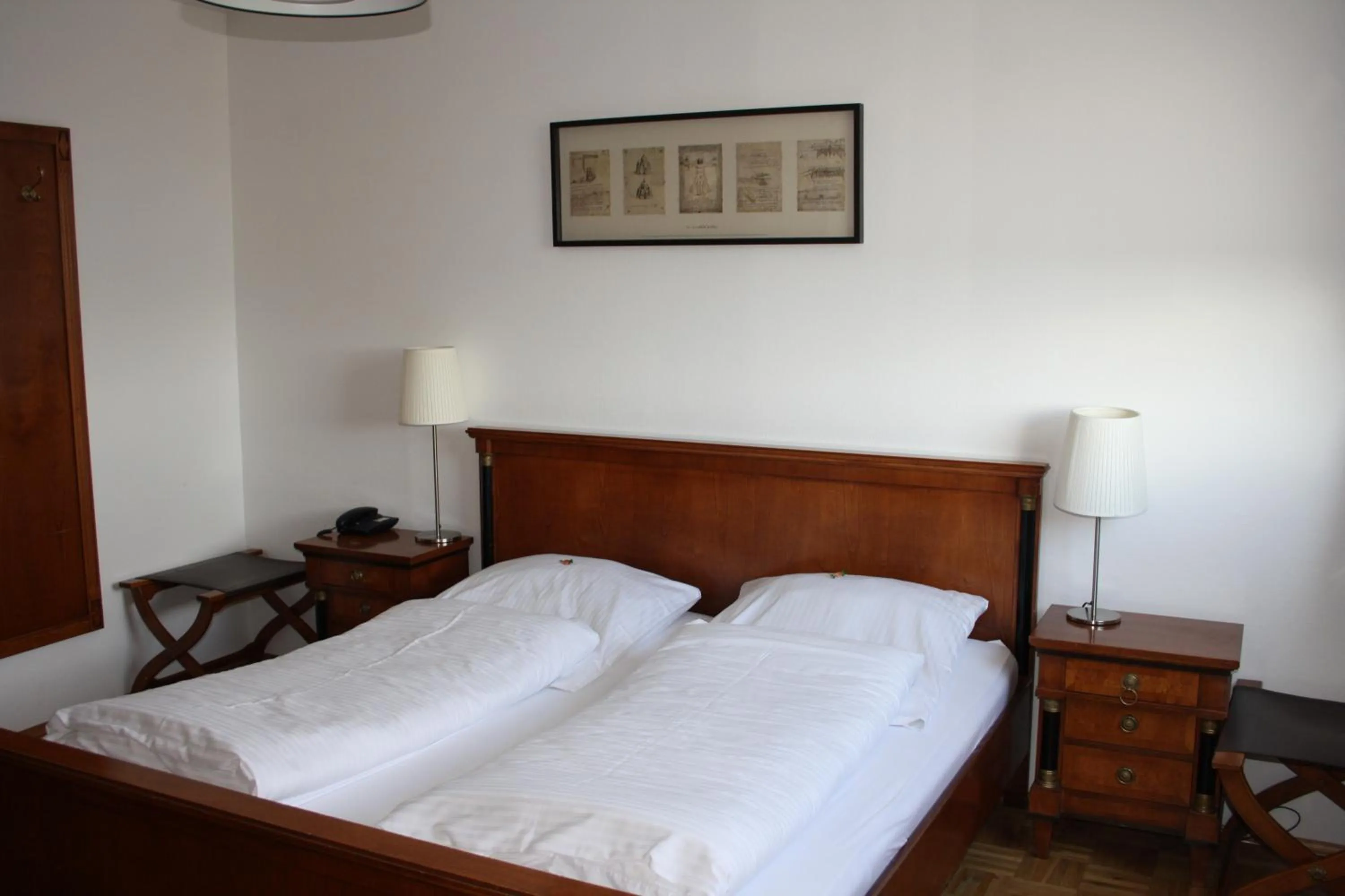 Bed in Hotel Schwarzer Adler