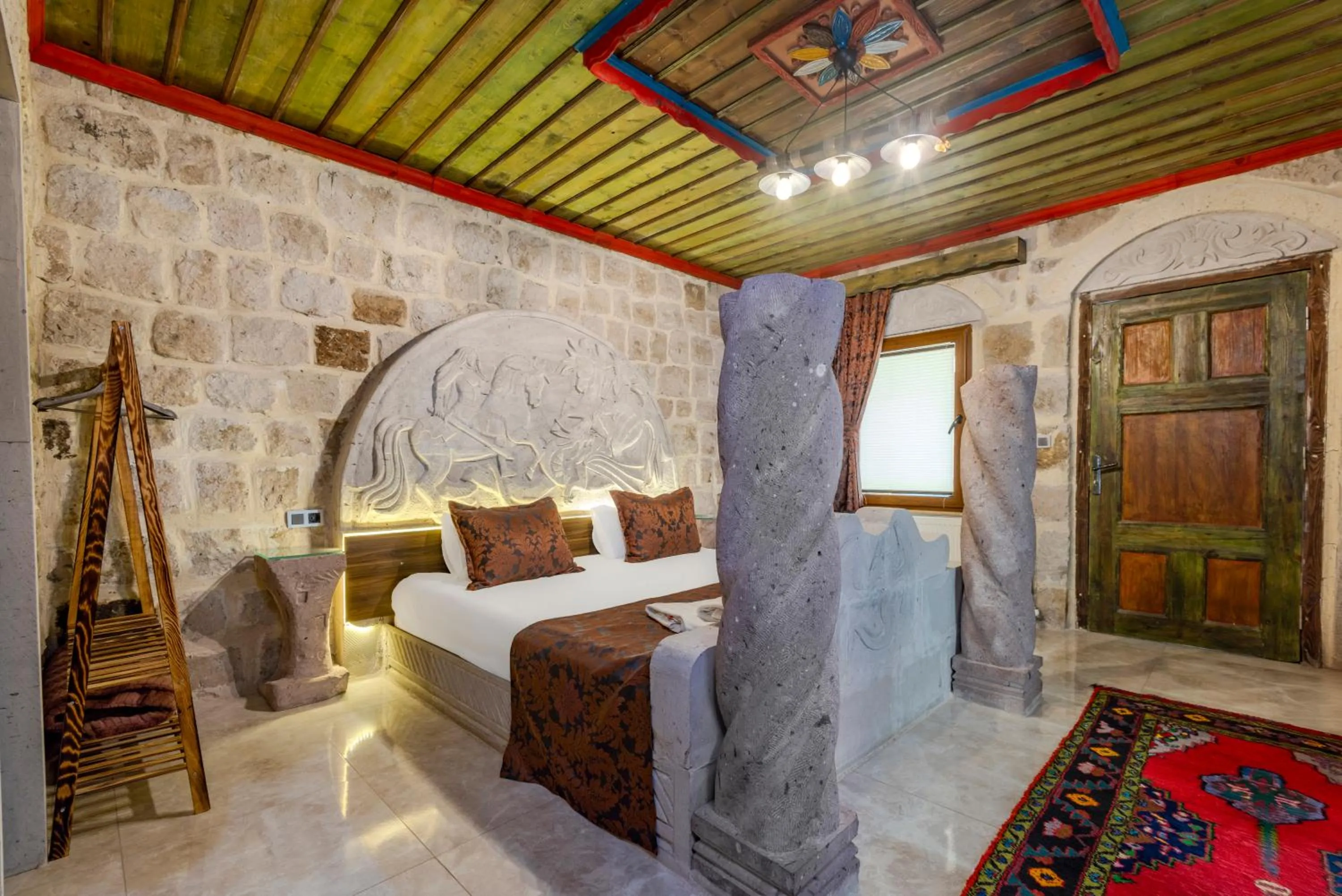 Bed in Kayatas Cave Suites