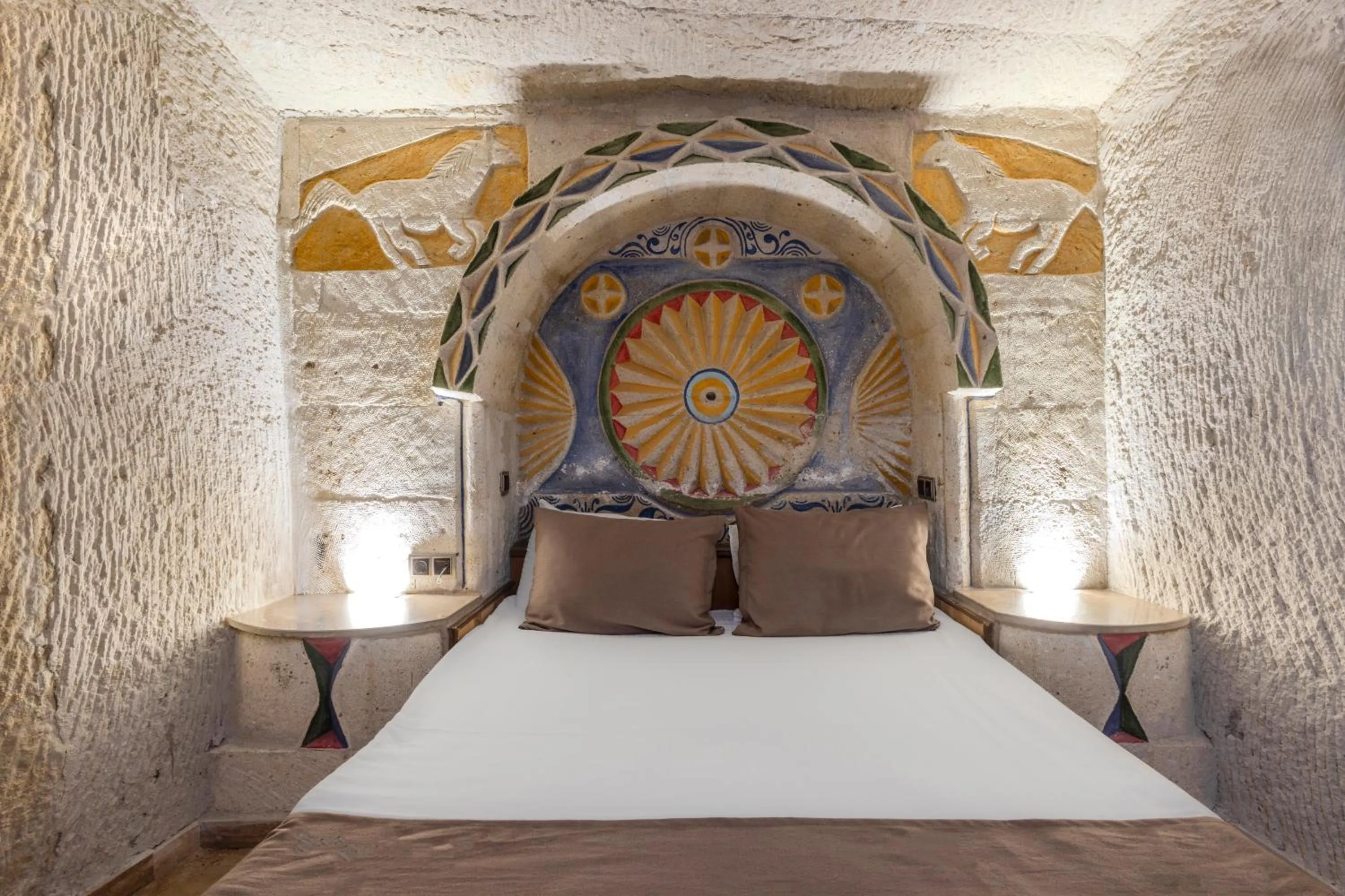 Bed in Kayatas Cave Suites