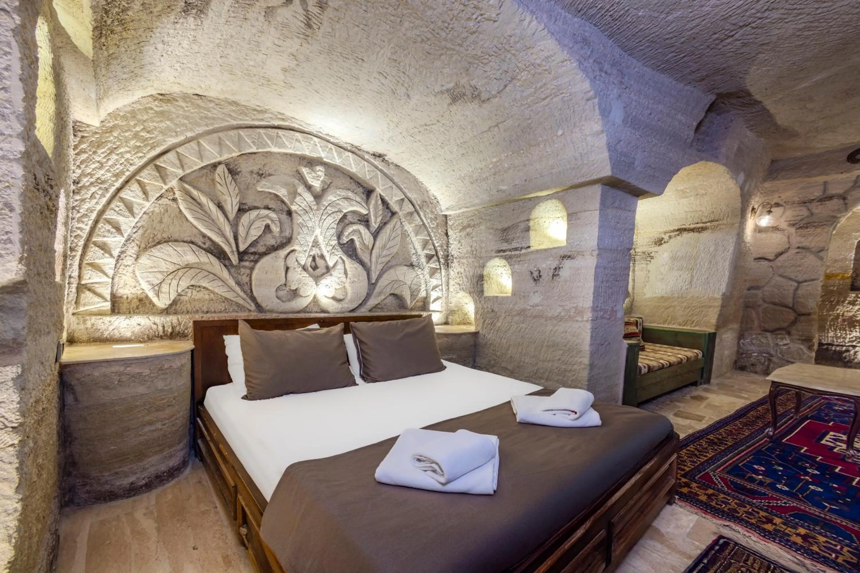 Bed in Kayatas Cave Suites