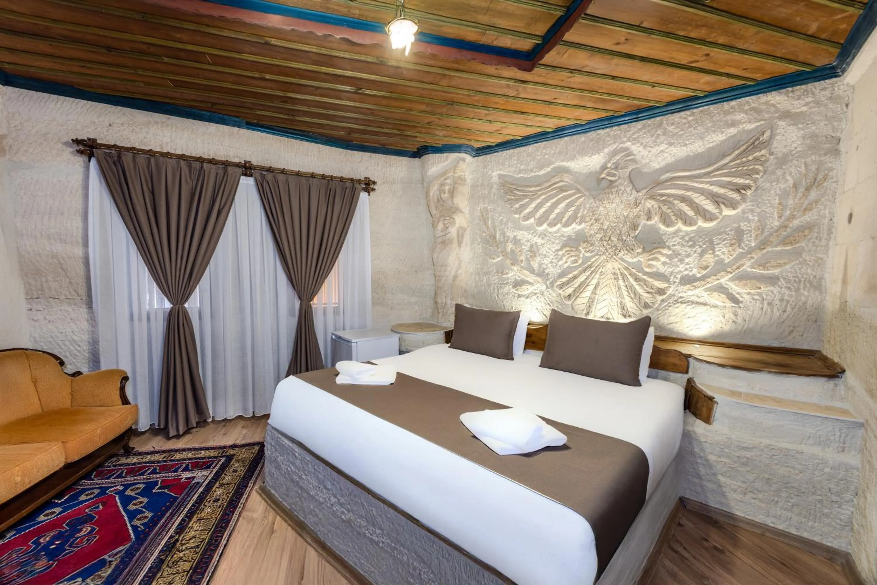 Bed in Kayatas Cave Suites