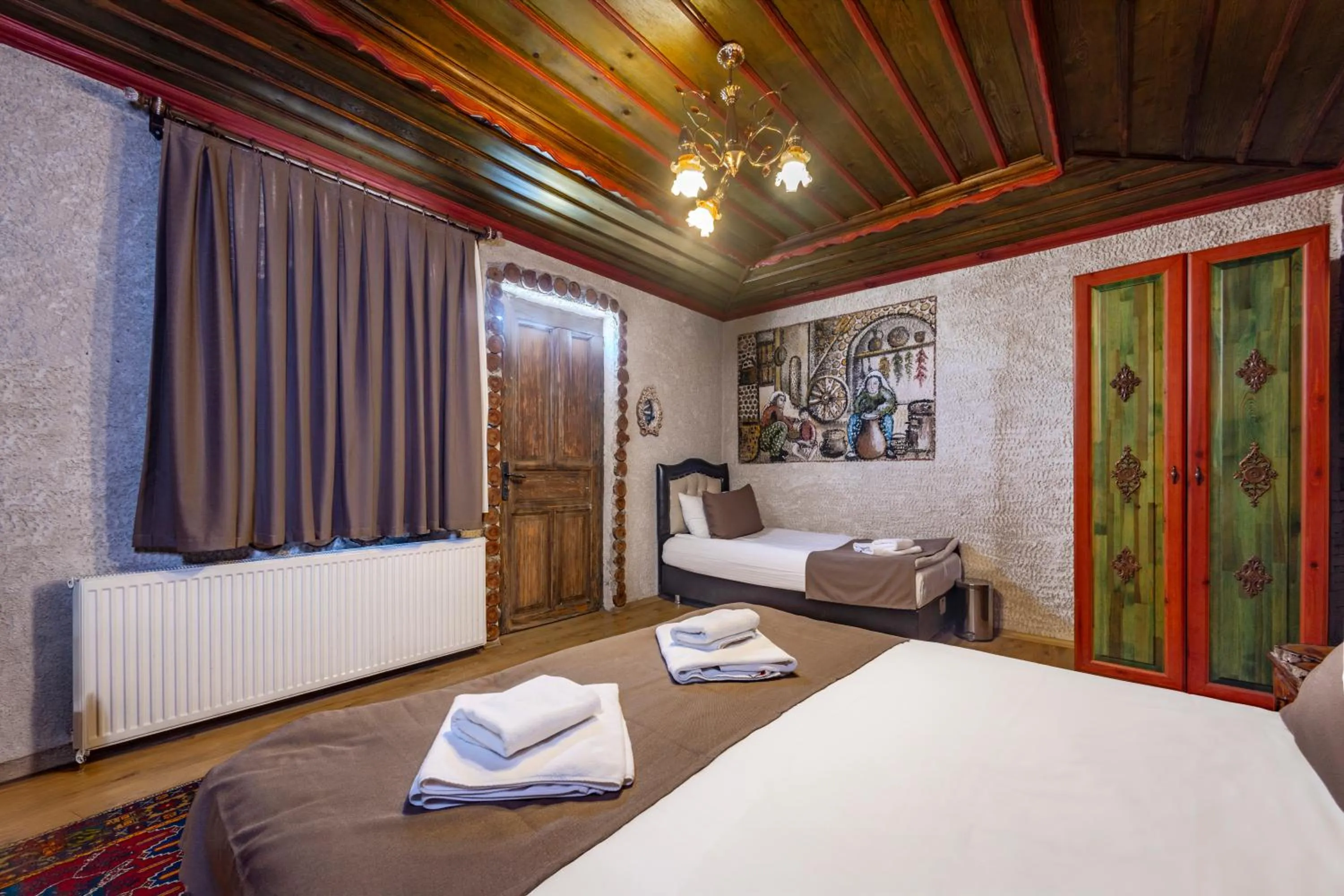 Bed in Kayatas Cave Suites