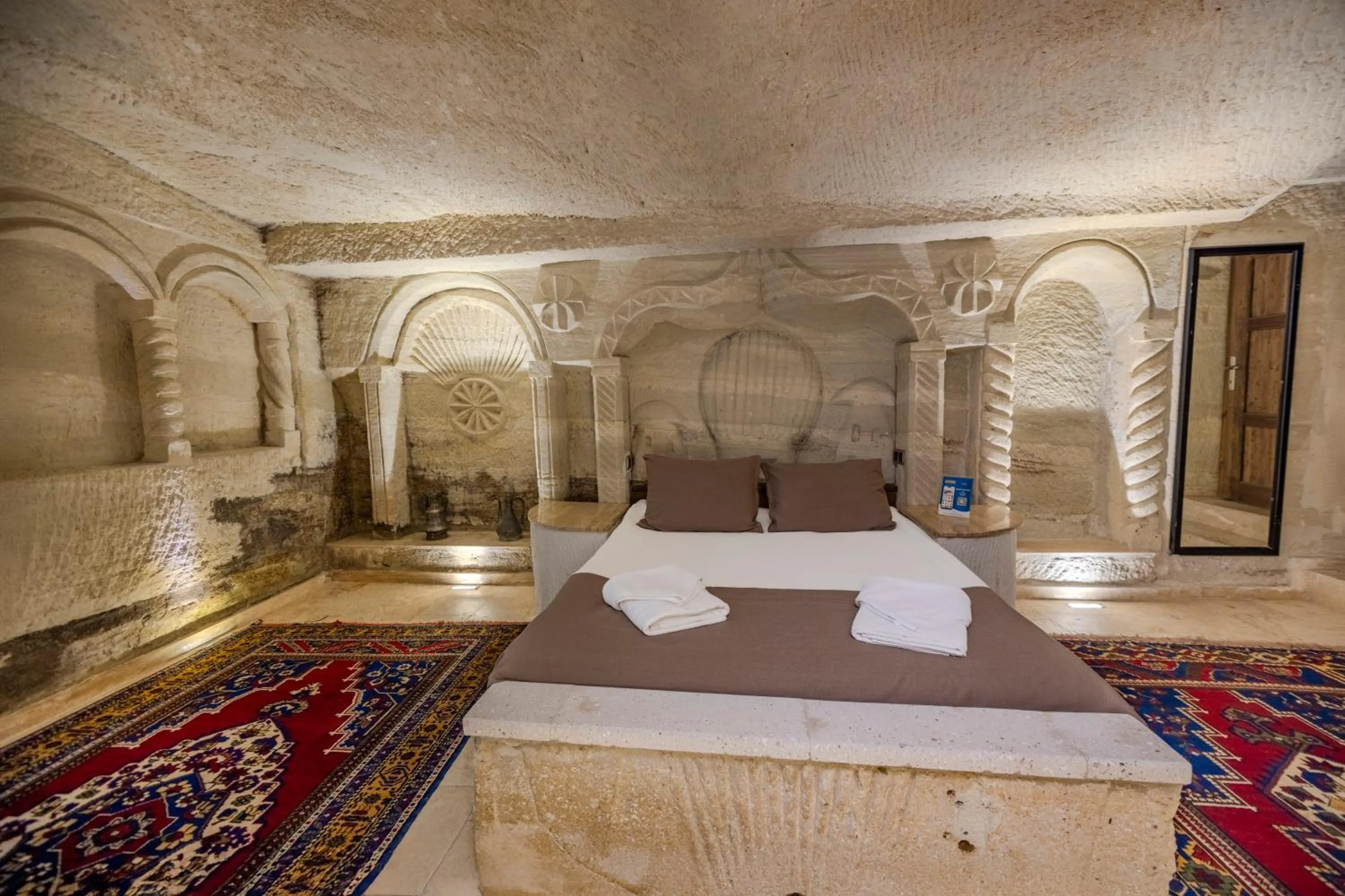 Bed in Kayatas Cave Suites