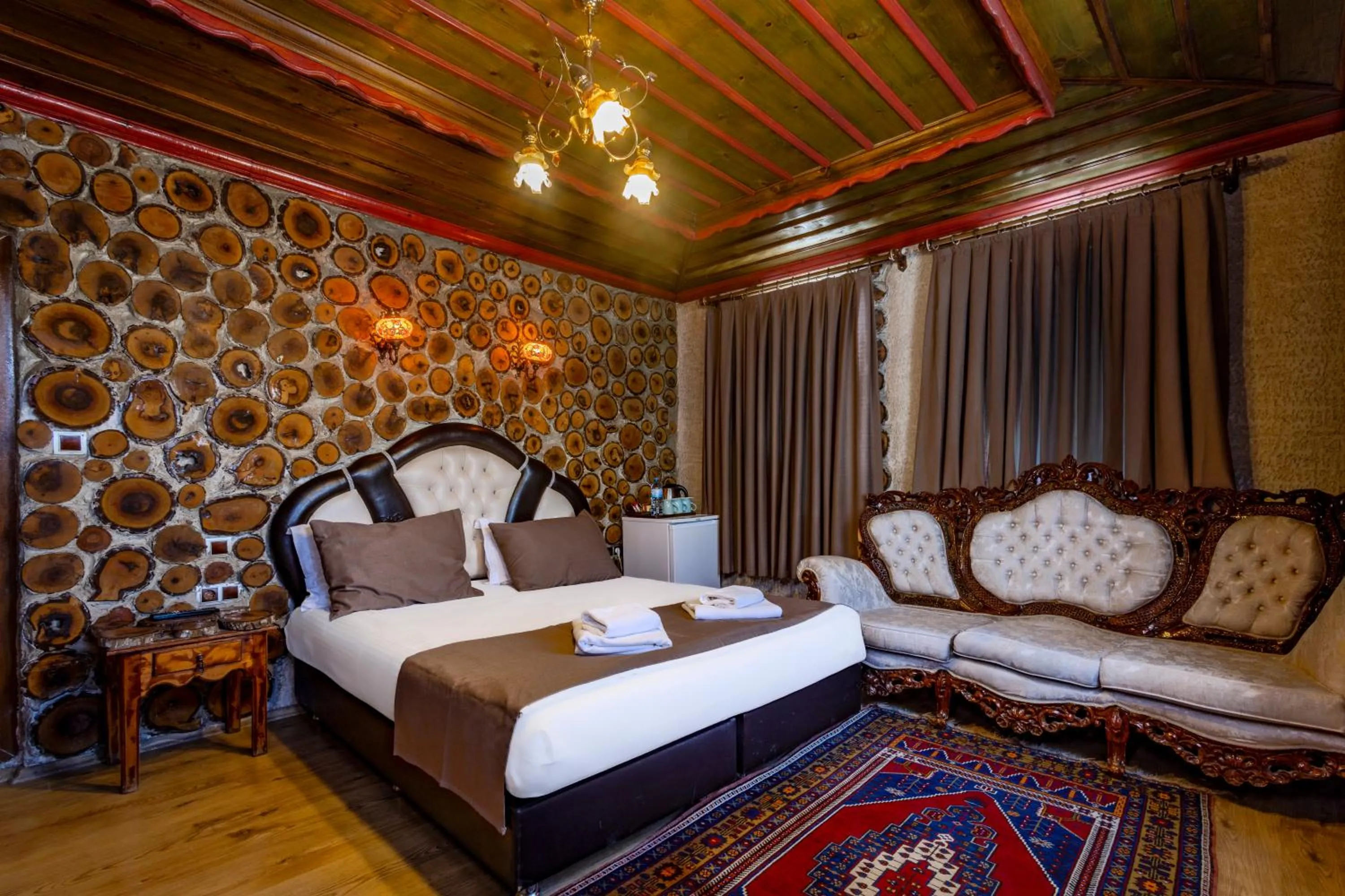 Bed in Kayatas Cave Suites
