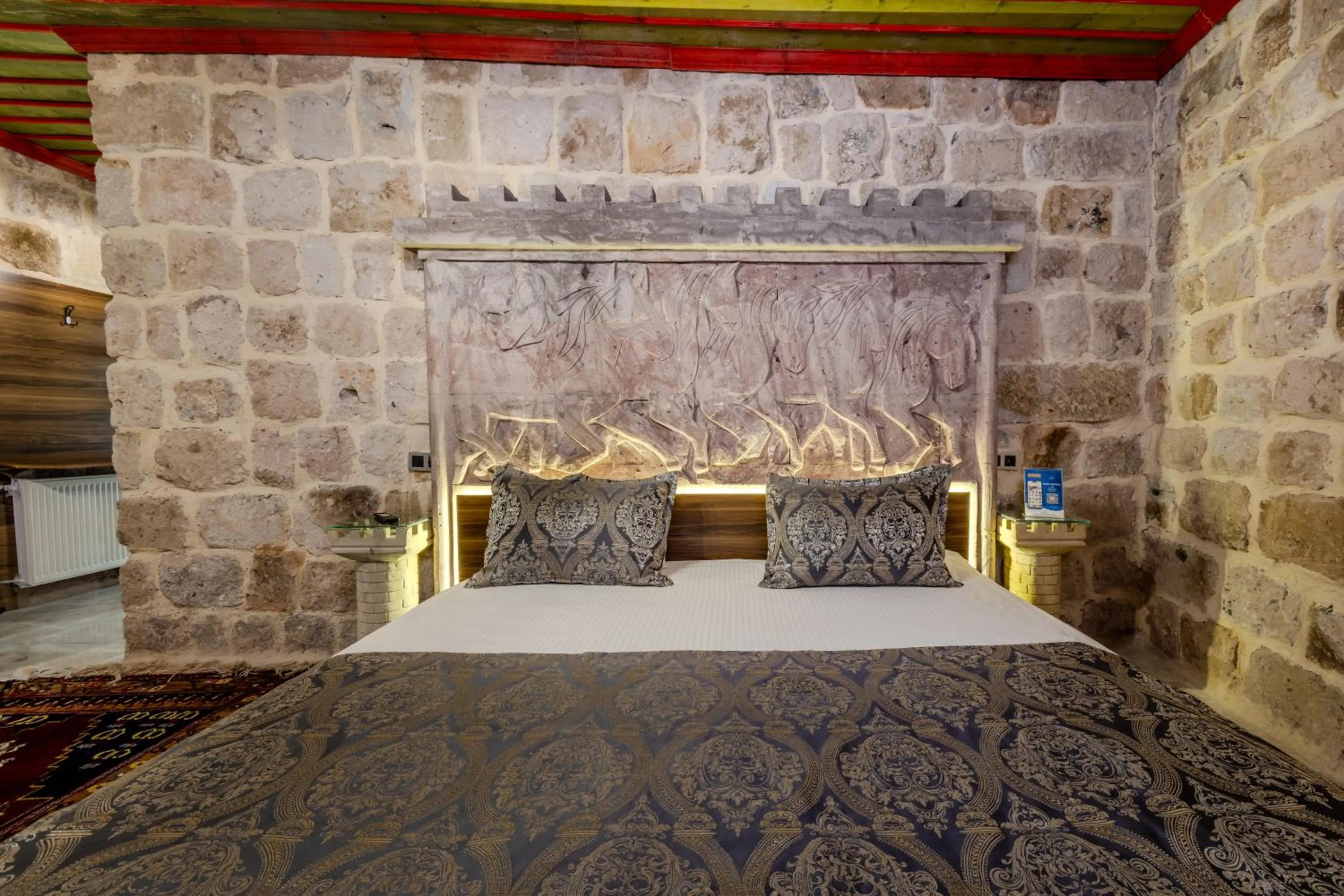 Bed in Kayatas Cave Suites