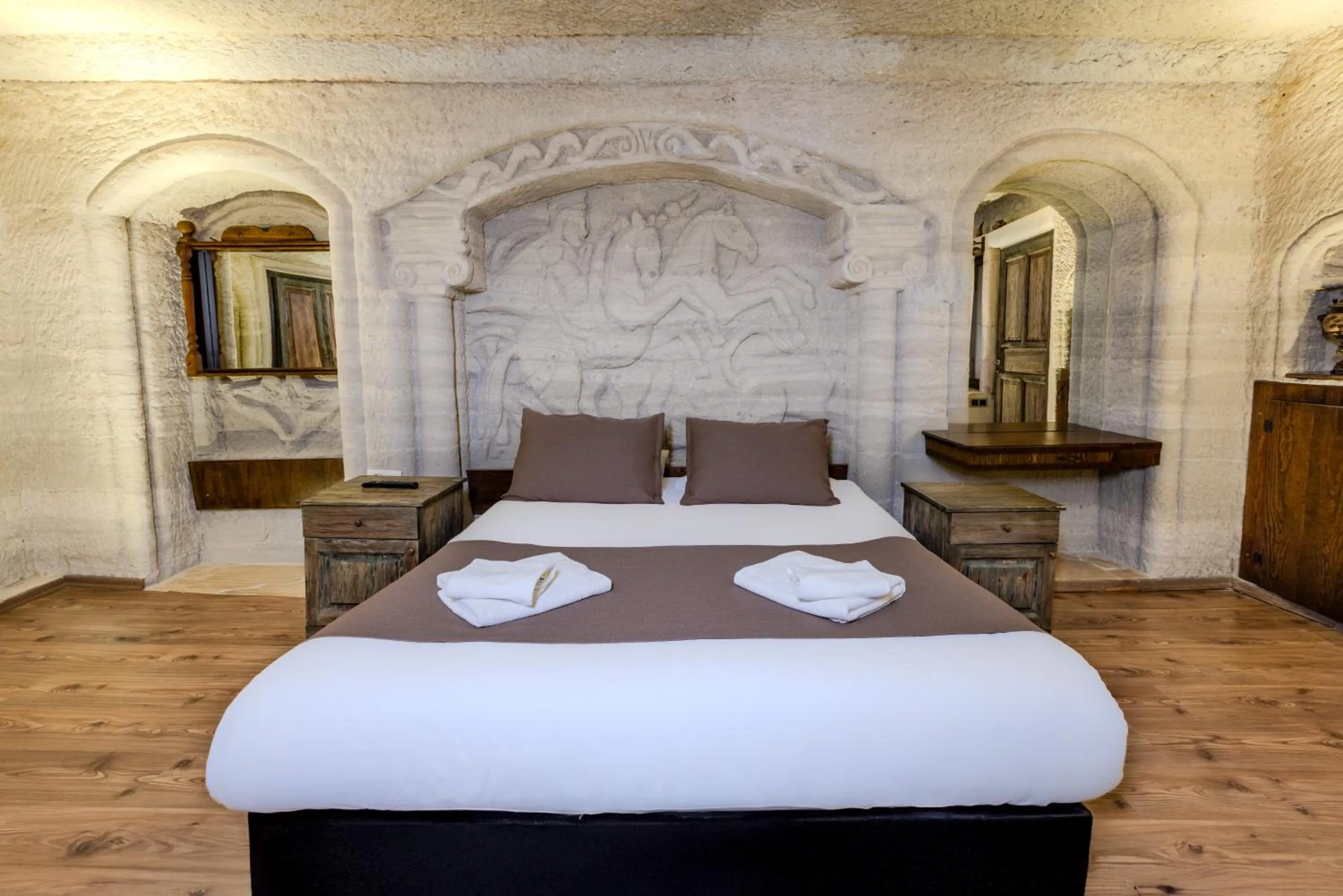 Bed in Kayatas Cave Suites