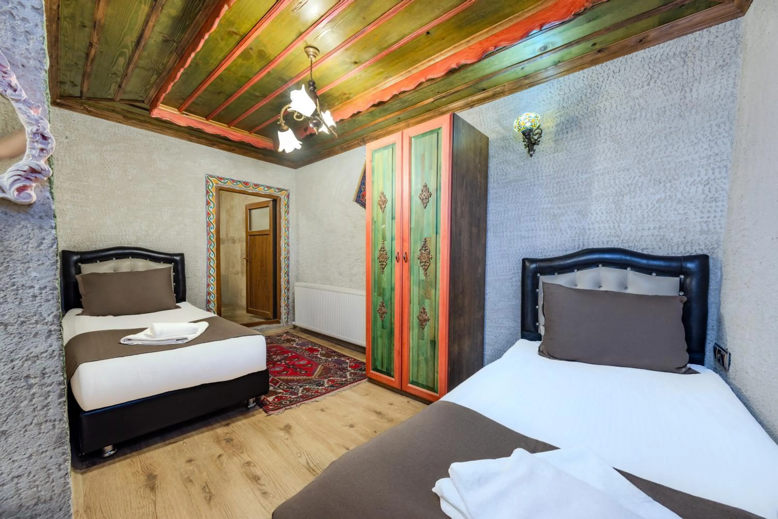 Bed in Kayatas Cave Suites