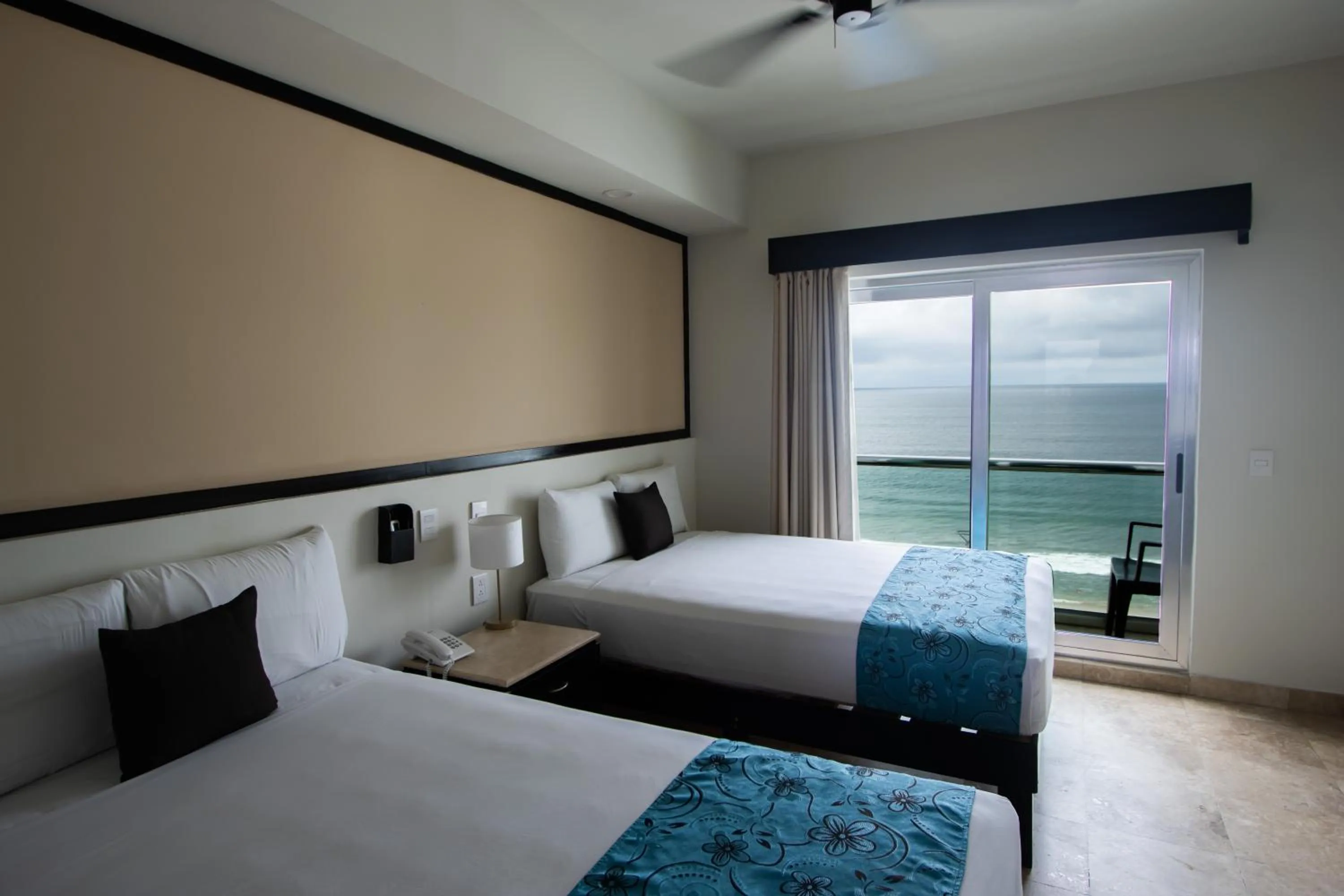 Bed in Coral Island Beach View Hotel