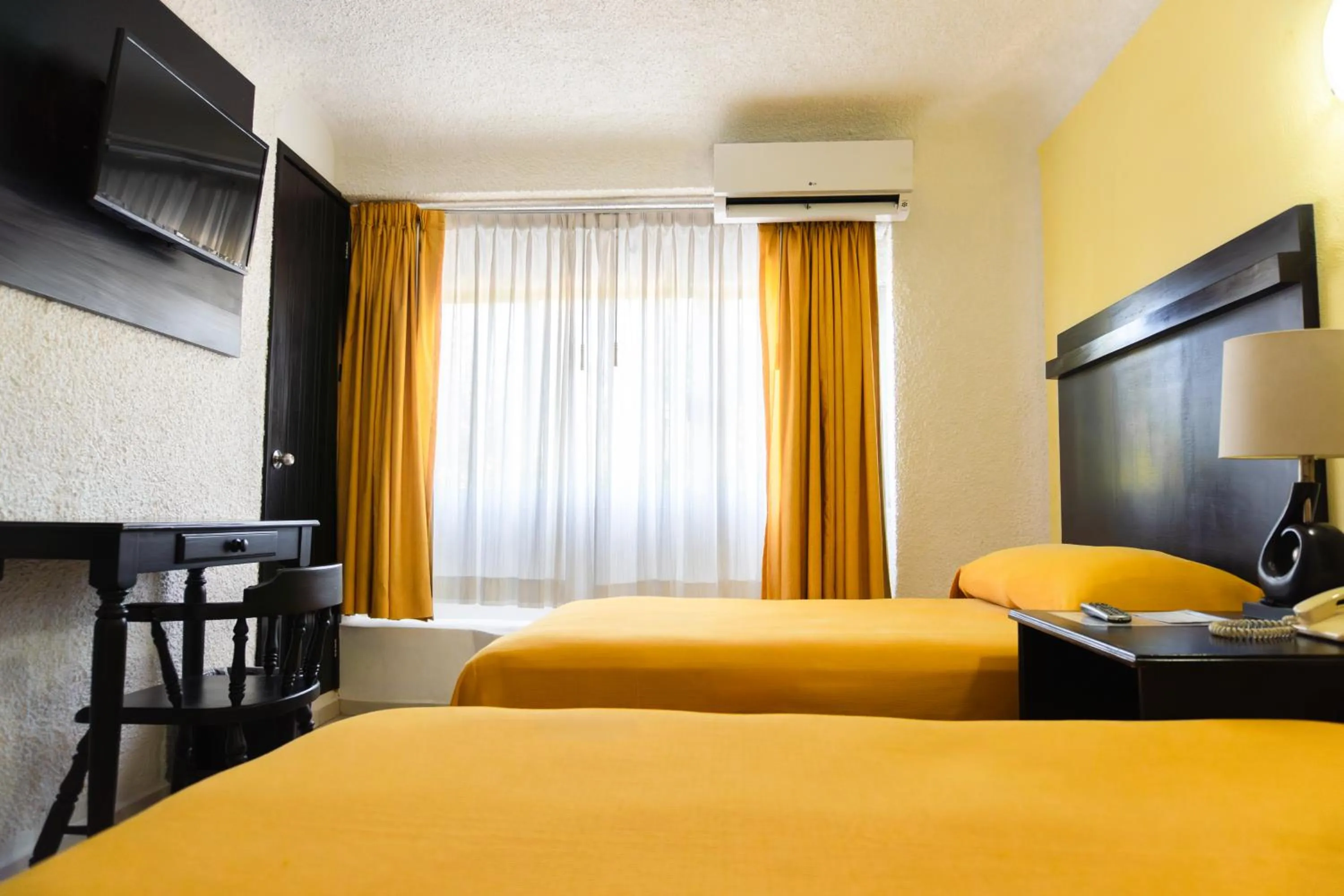 Bed in Hotel Antillano