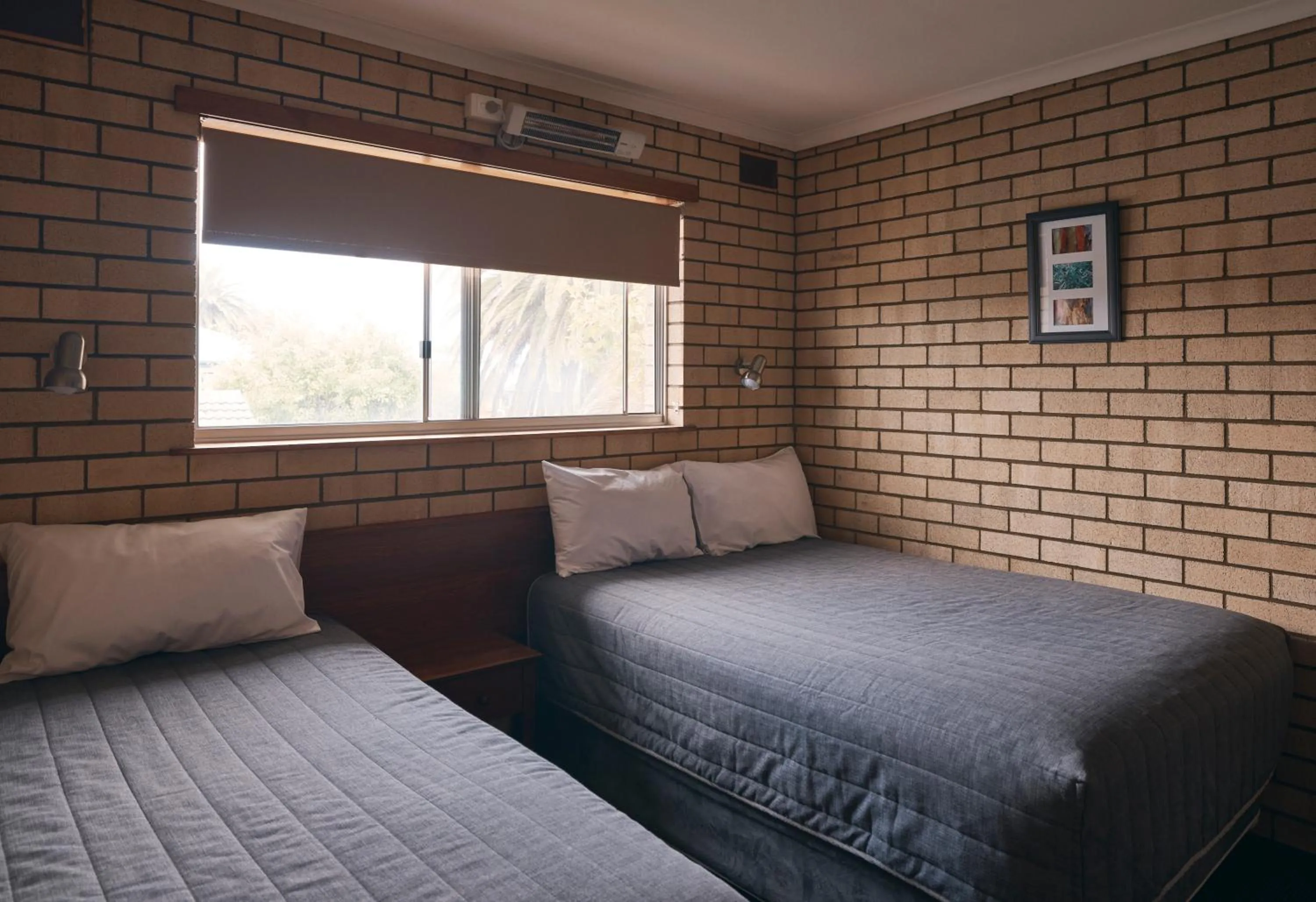 Bed in Coastal Comfort Motel