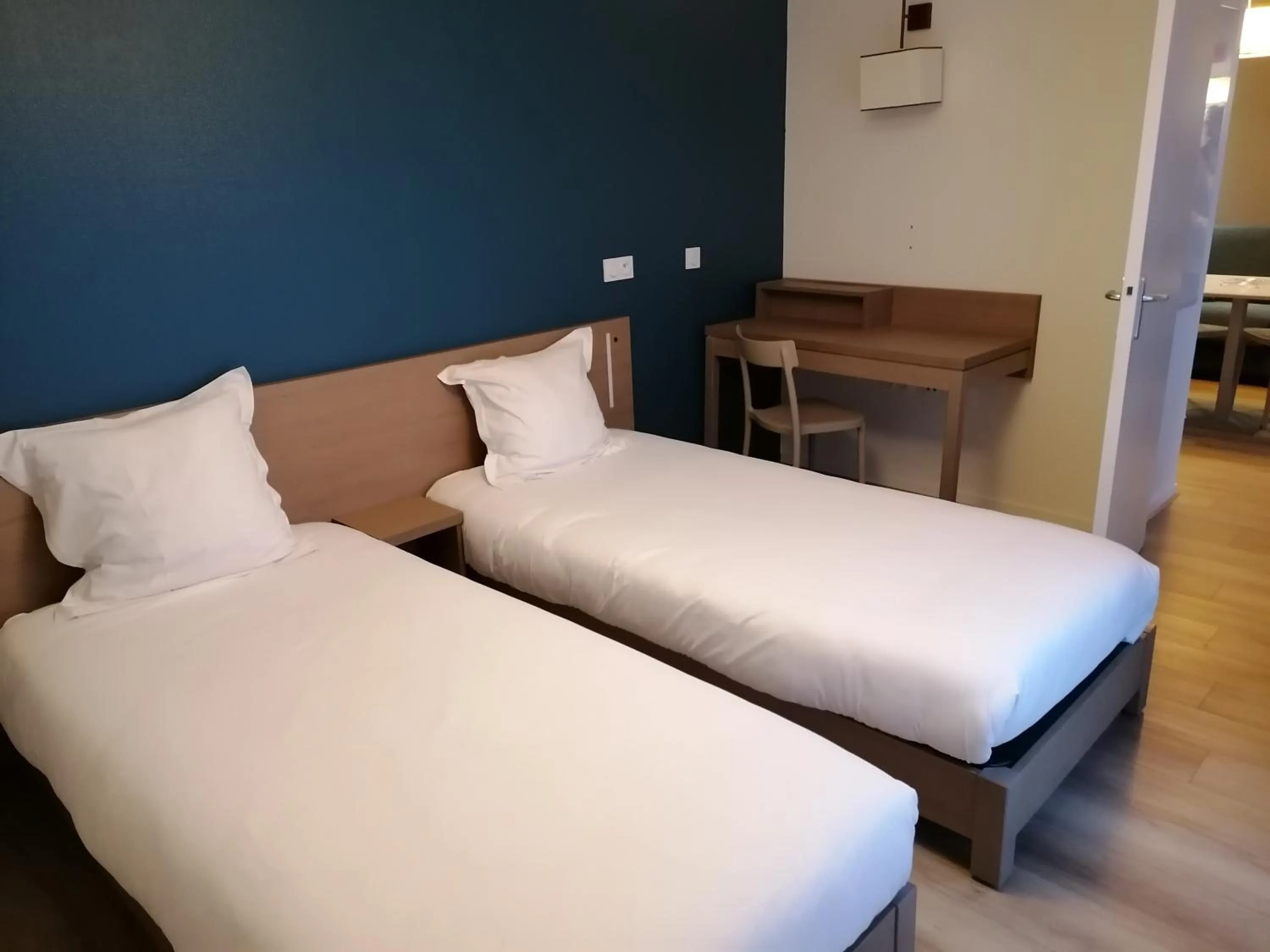 Bedroom, Bed in Terres de France - Appart'Hotel Quimper Bretagne