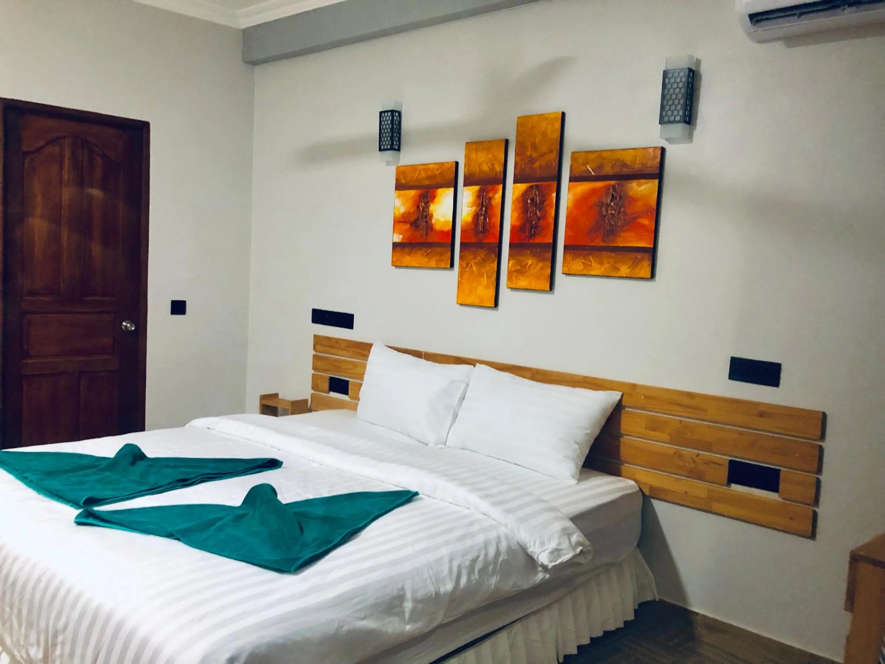 Bed in IRIS Beach Residence