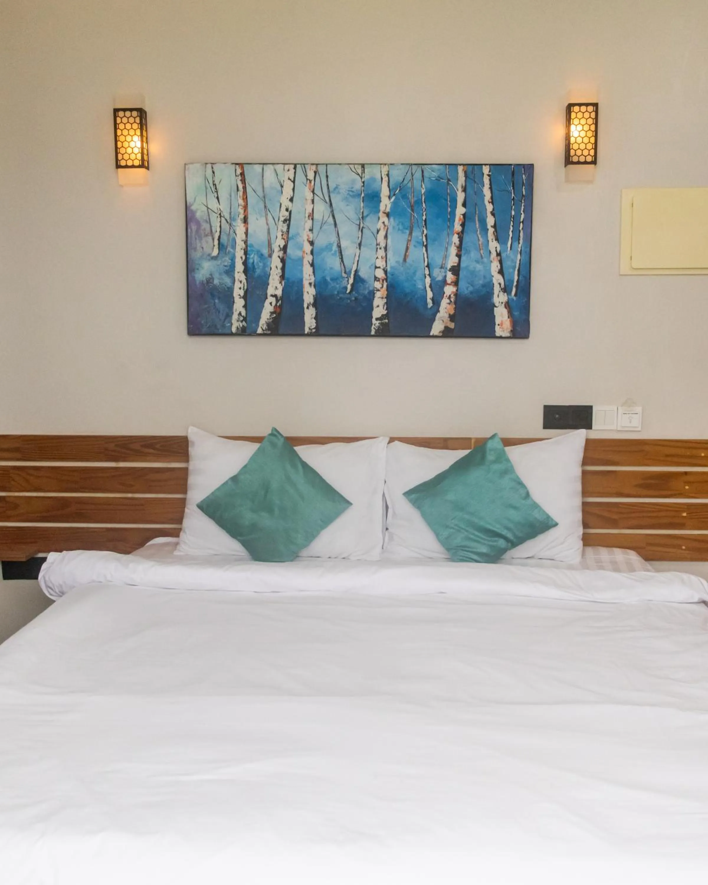 Bed in IRIS Beach Residence