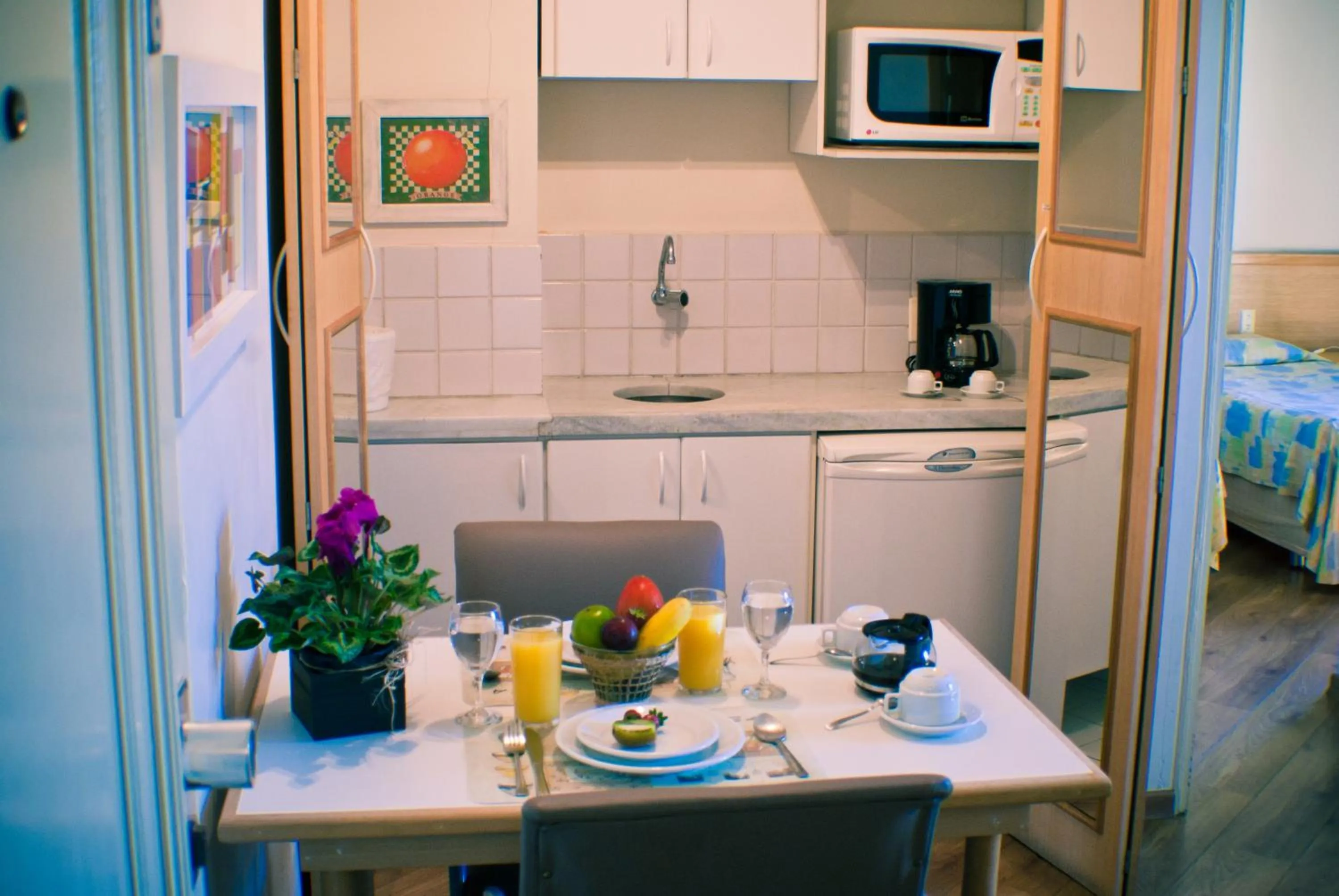 Kitchen or kitchenette, Bed in Residencial Bella Vista Suites