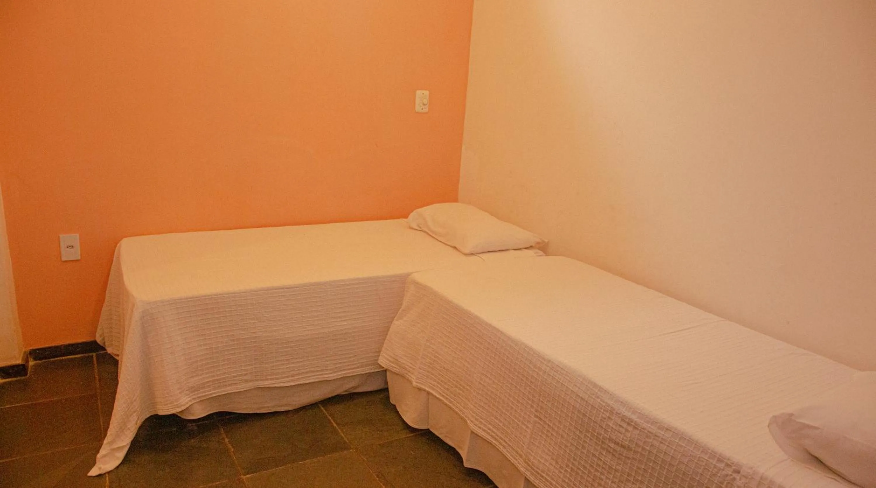 Bed in Pousada Canto do Rio