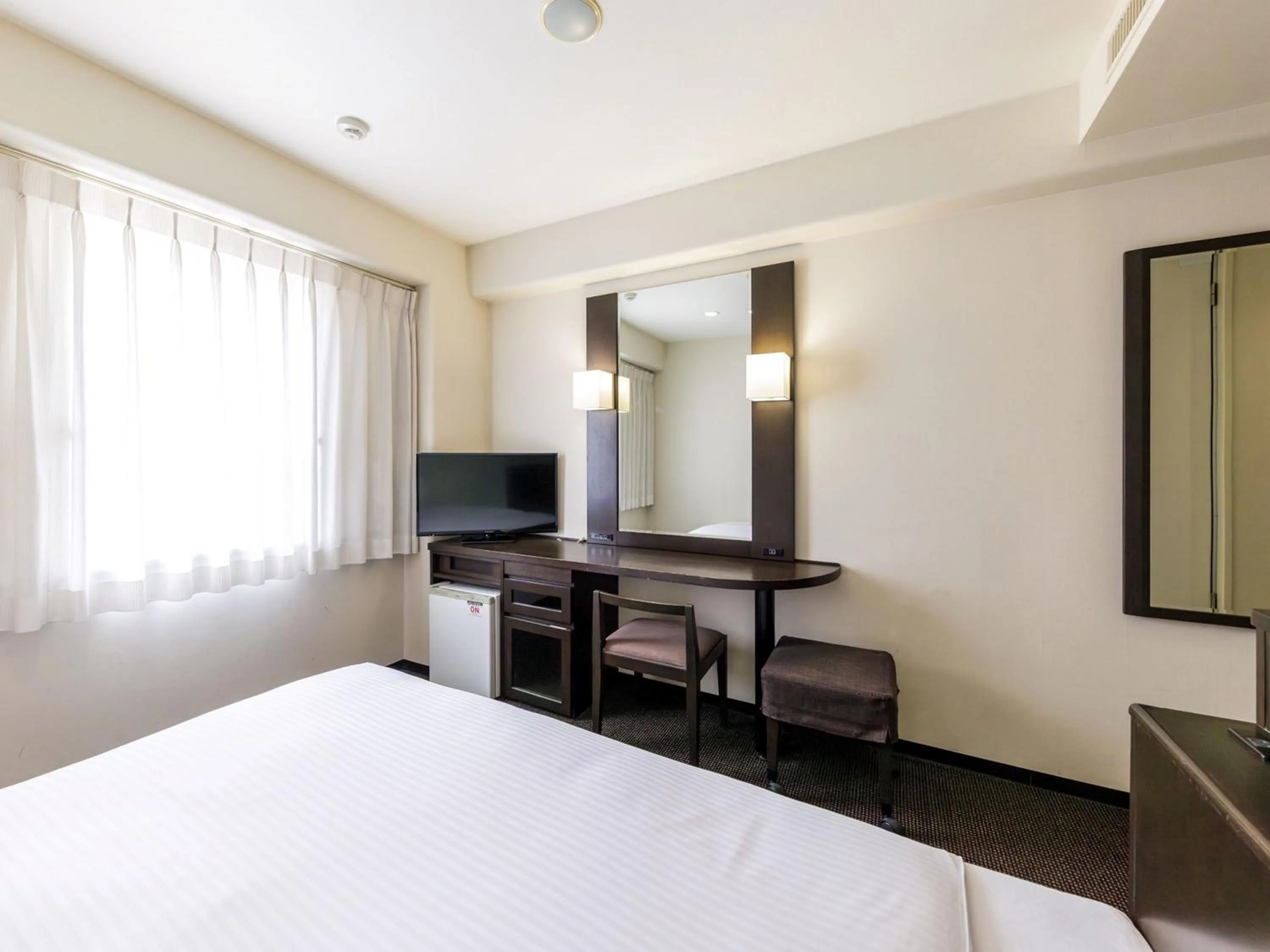 Bed in Nishitetsu Inn Kokura