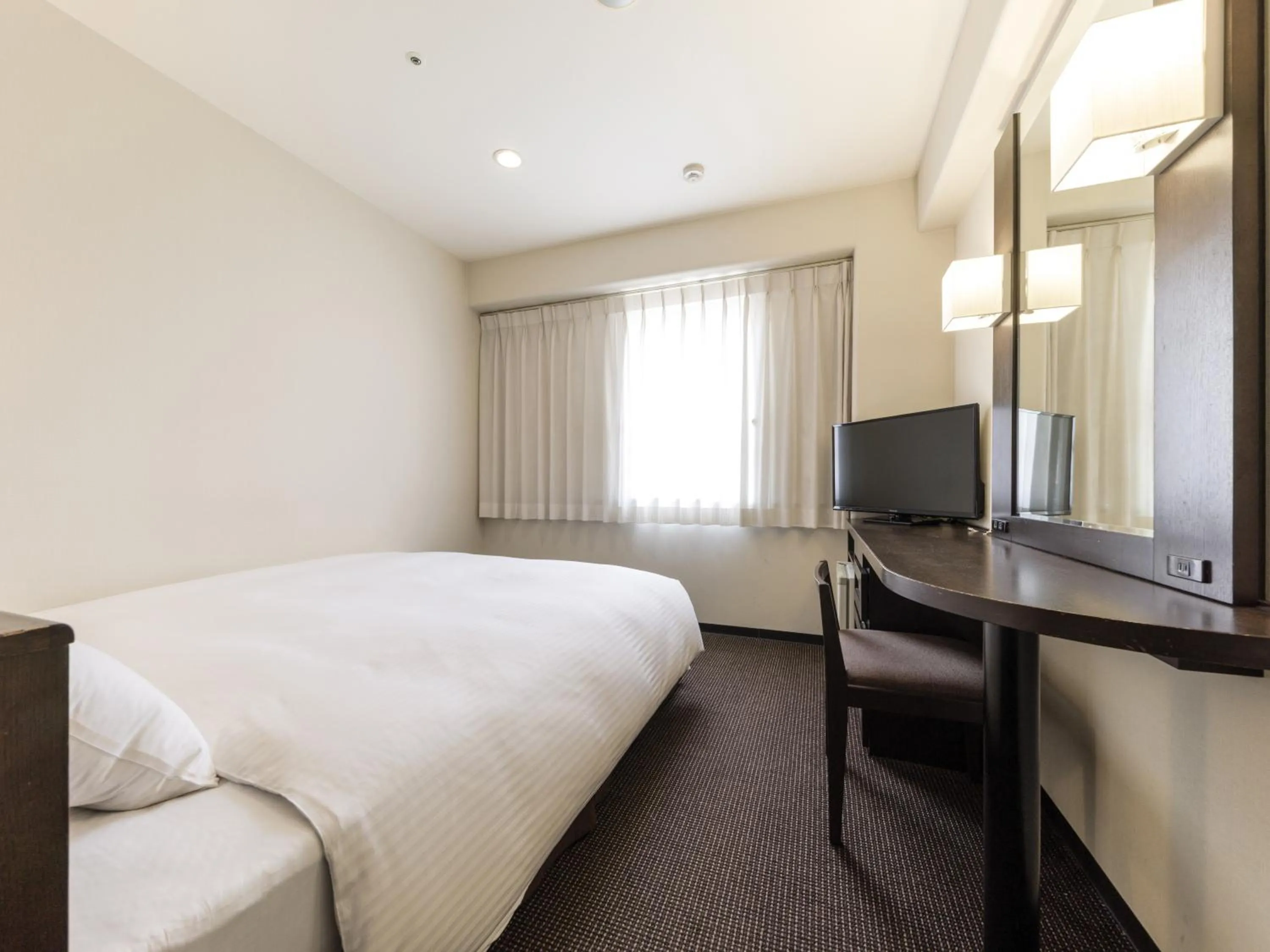 Photo of the whole room, Bed in Nishitetsu Inn Kokura