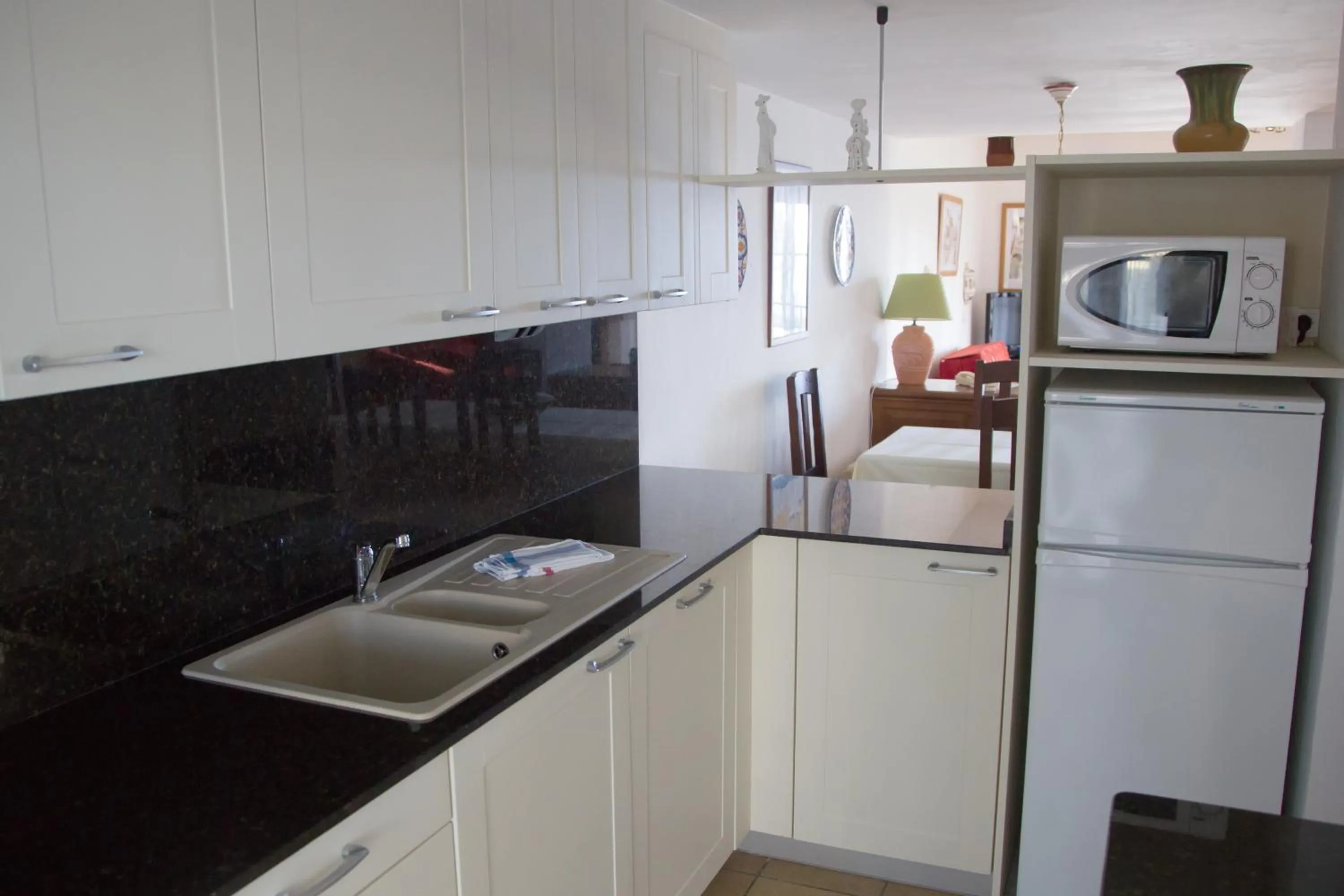 Kitchen or kitchenette in Apartamentos Parque Mar