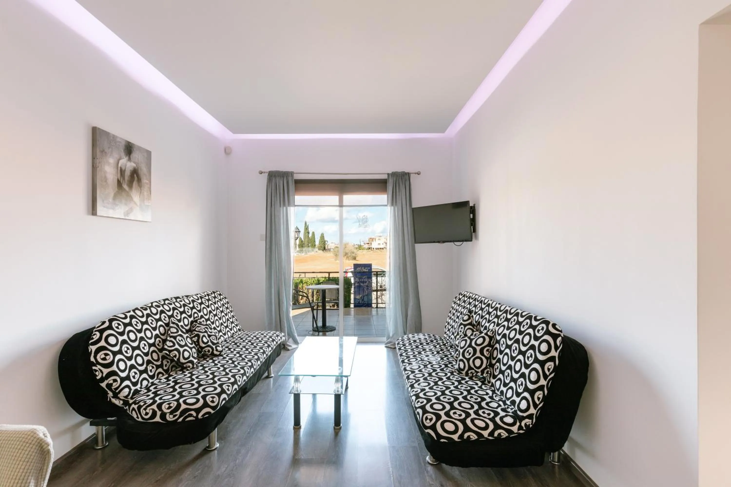 Communal lounge/ TV room in Neptune Hotel Apartments Paphos