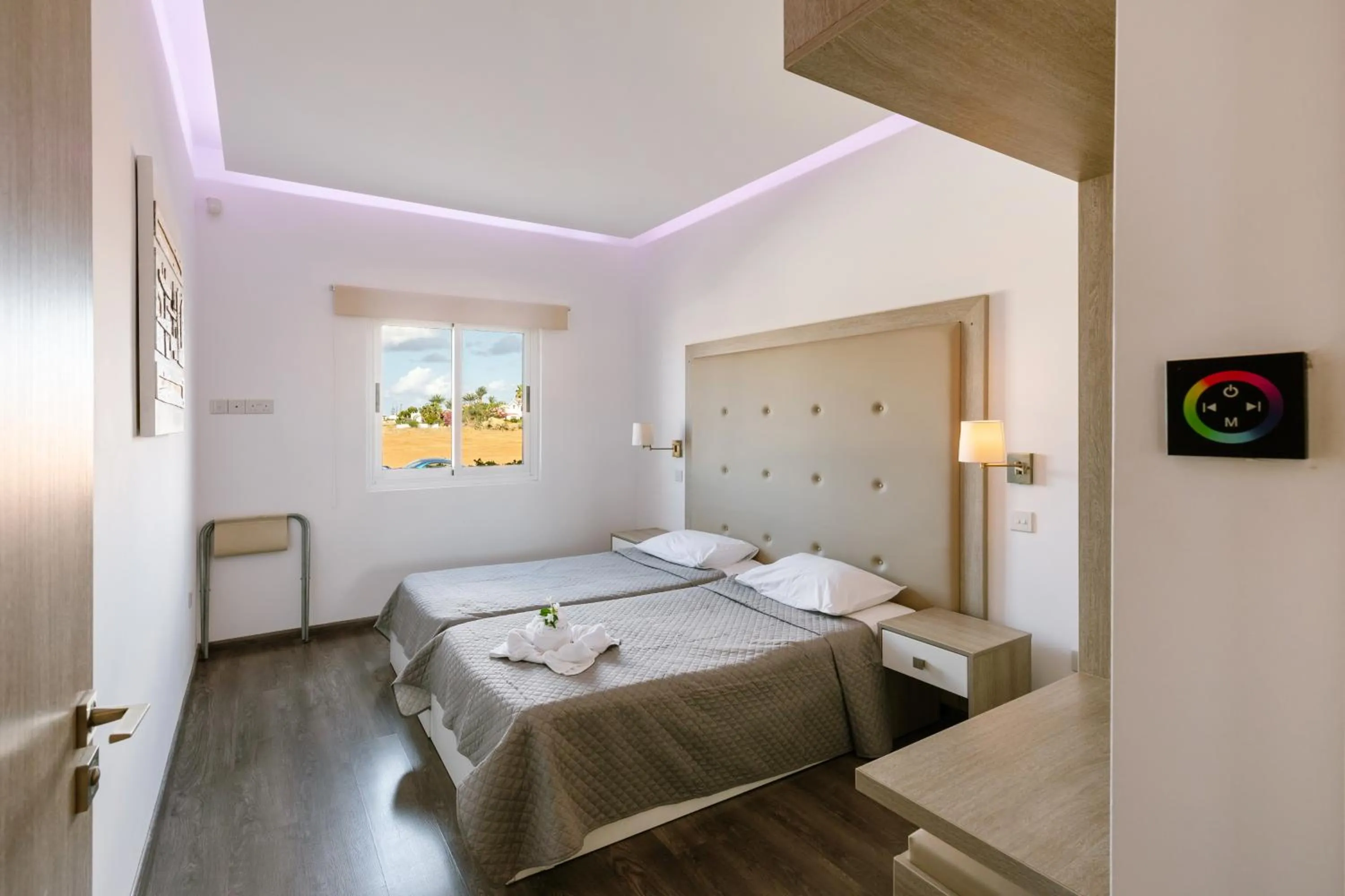 Bed in Neptune Hotel Apartments Paphos